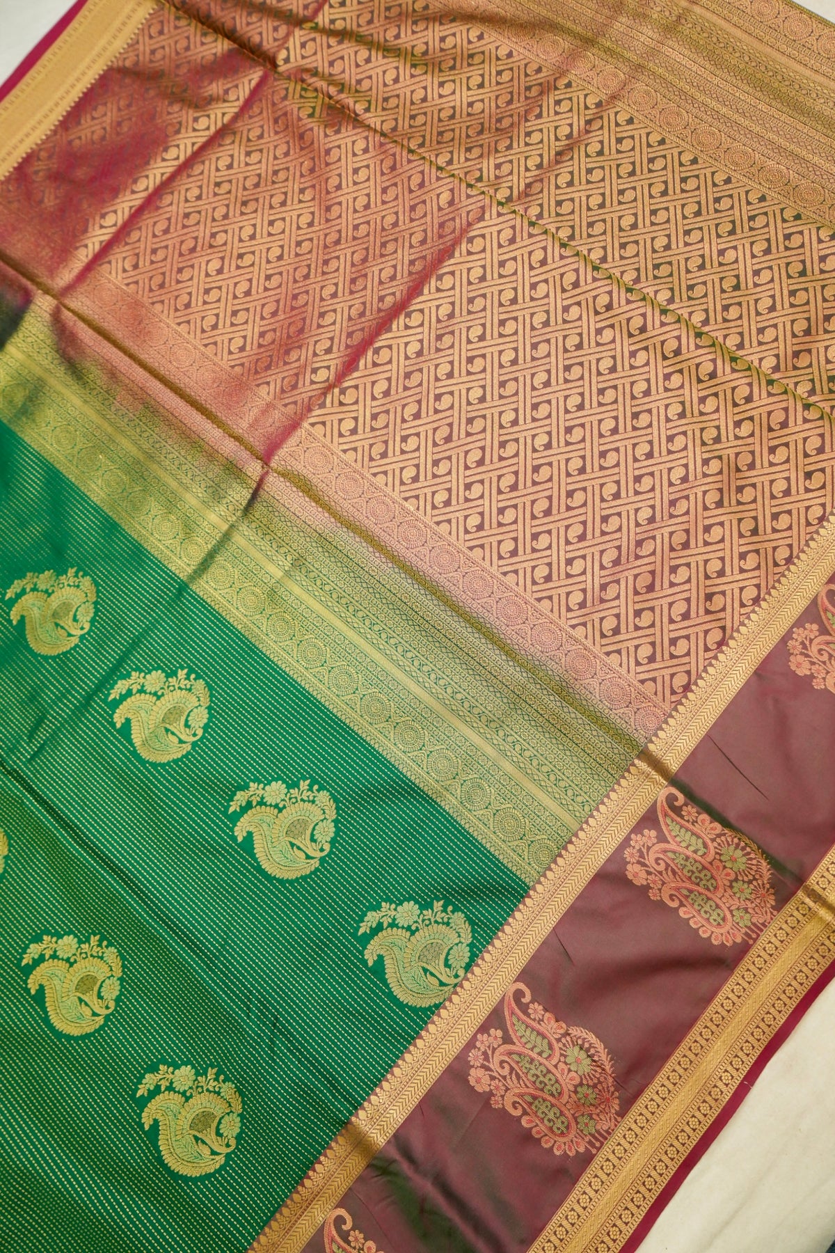 Devyani - Emerald Green Kanjivaram Silk Saree with Mauve Korvai Border