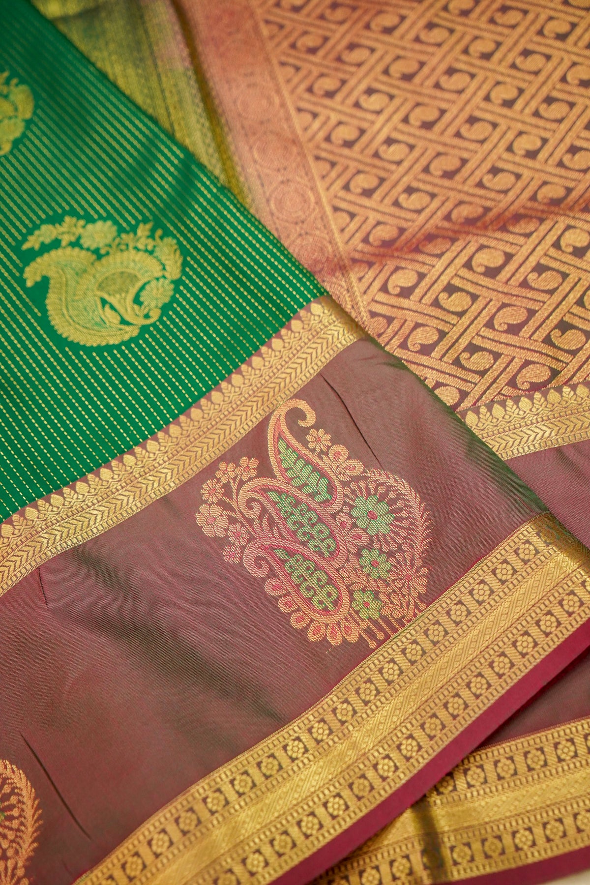 Devyani - Emerald Green Kanjivaram Silk Saree with Mauve Korvai Border