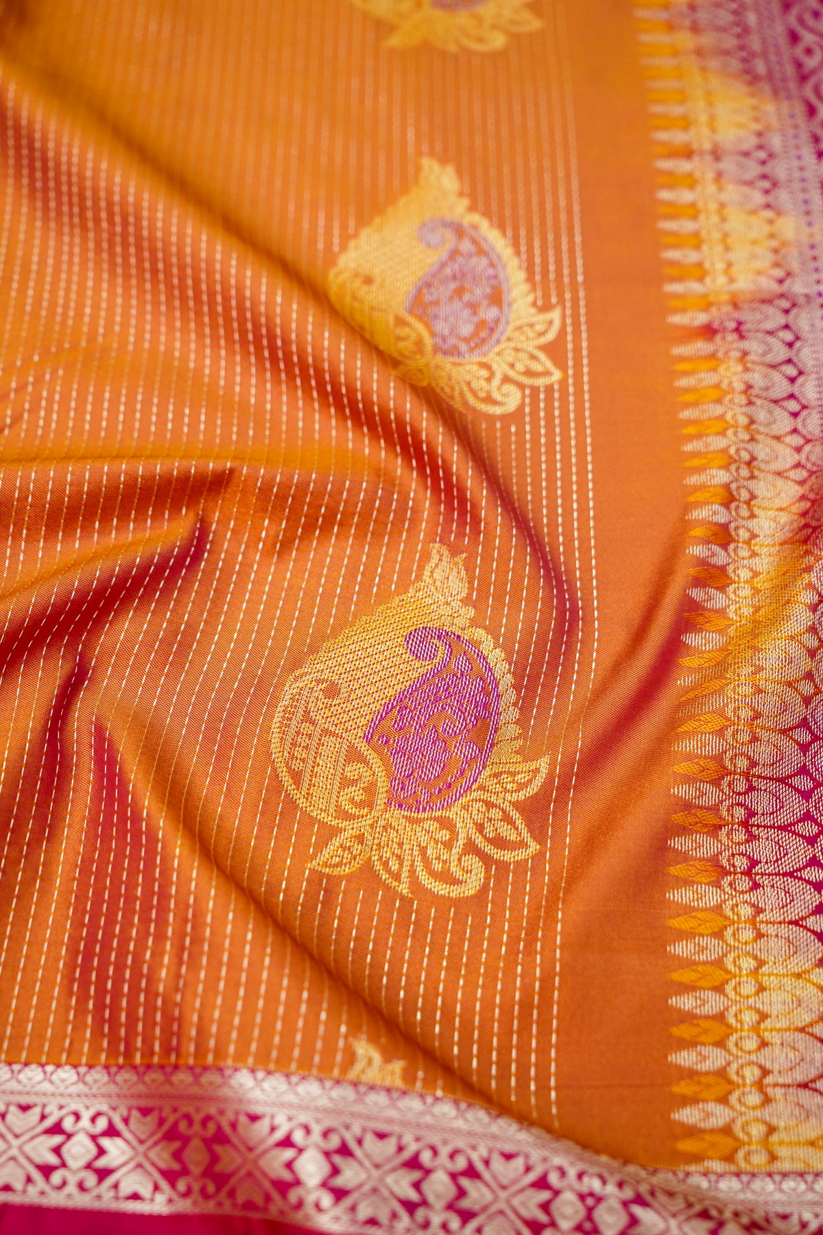 Devyani - Copper Orange Kanjivaram Silk Saree with Pink Korvai Border