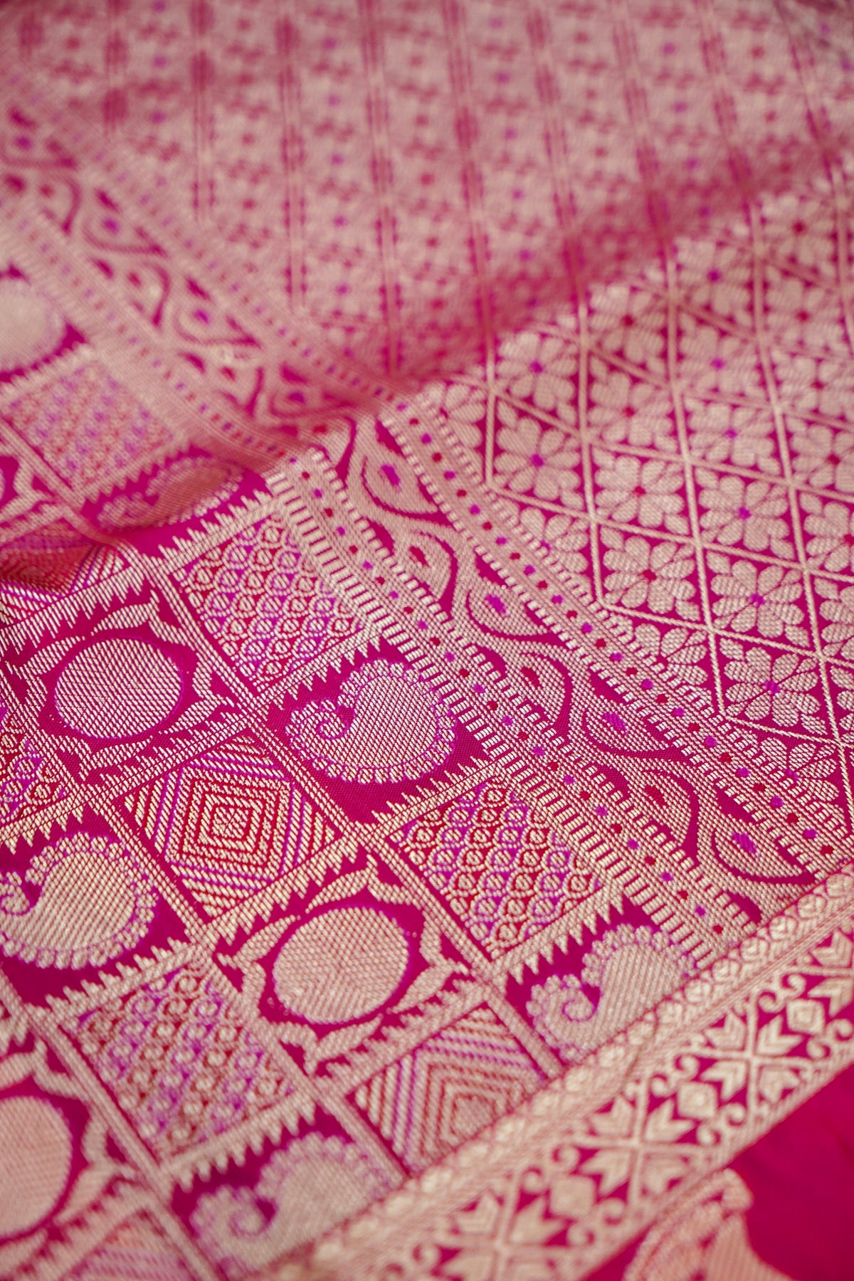 Devyani - Copper Orange Kanjivaram Silk Saree with Pink Korvai Border