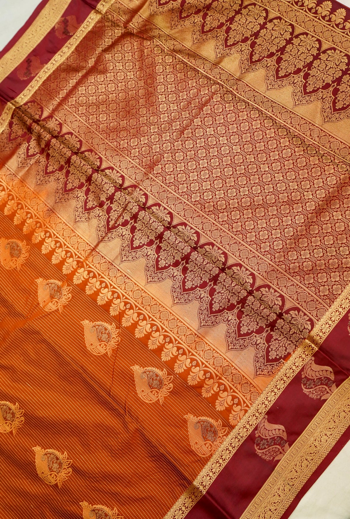 Devyani - Rust Orange Kanjivaram Silk Saree with Burgundy Korvai Border