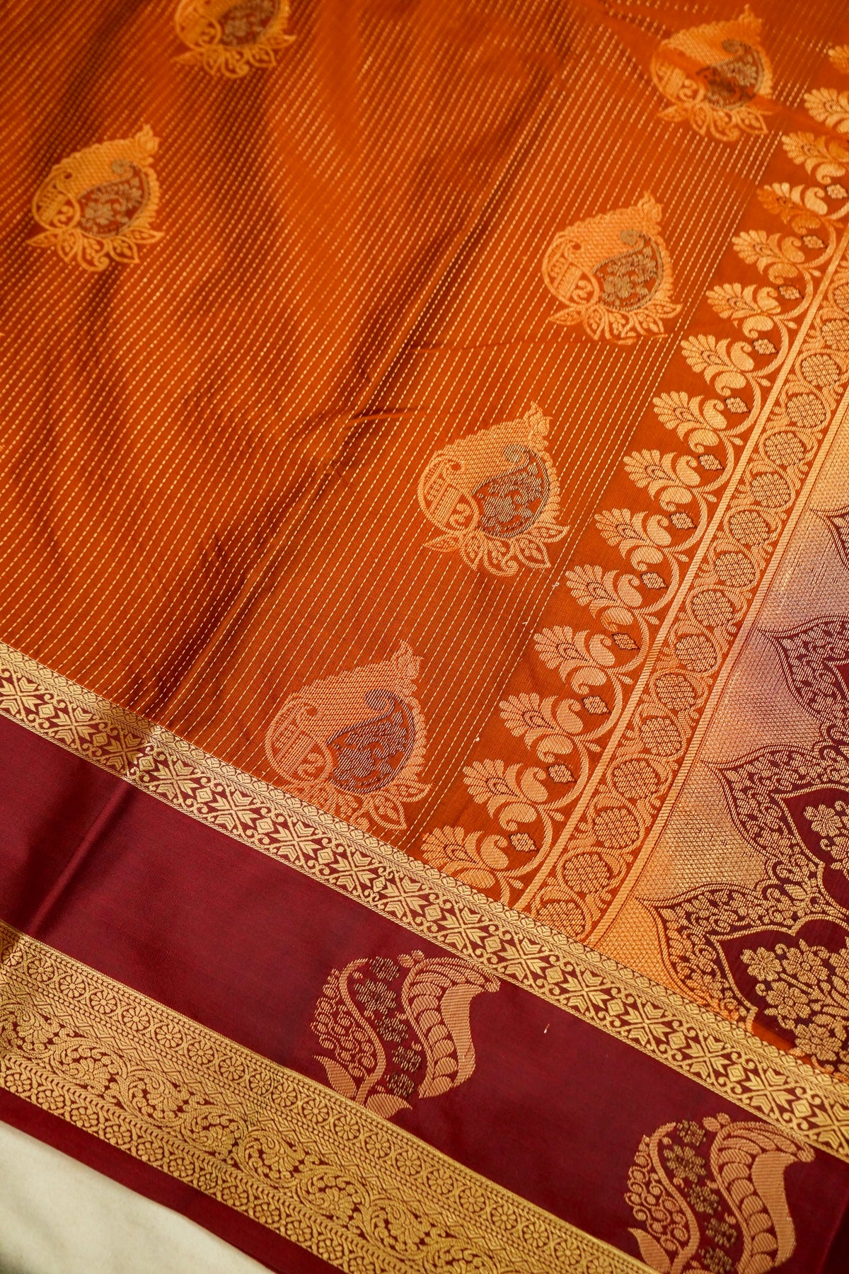 Devyani - Rust Orange Kanjivaram Silk Saree with Burgundy Korvai Border