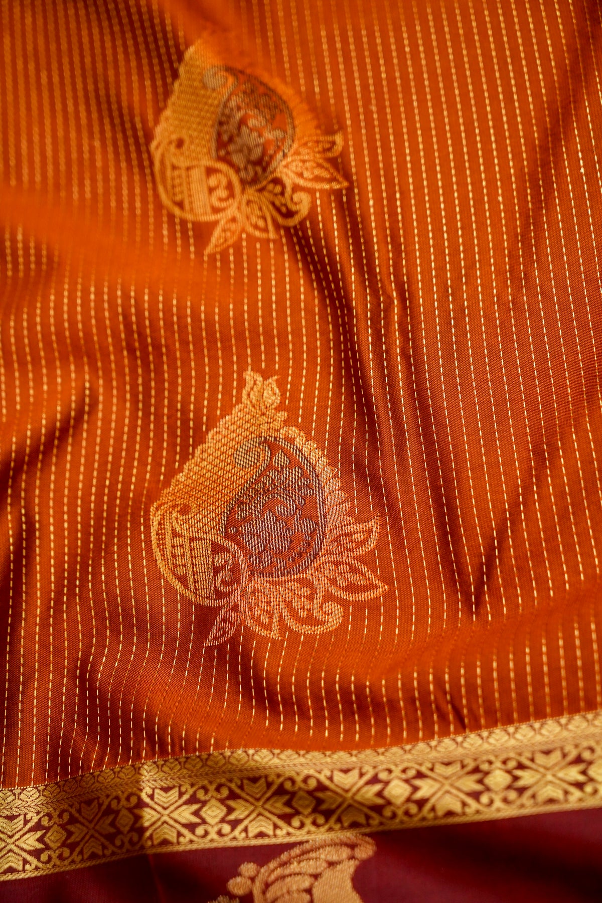 Devyani - Rust Orange Kanjivaram Silk Saree with Burgundy Korvai Border