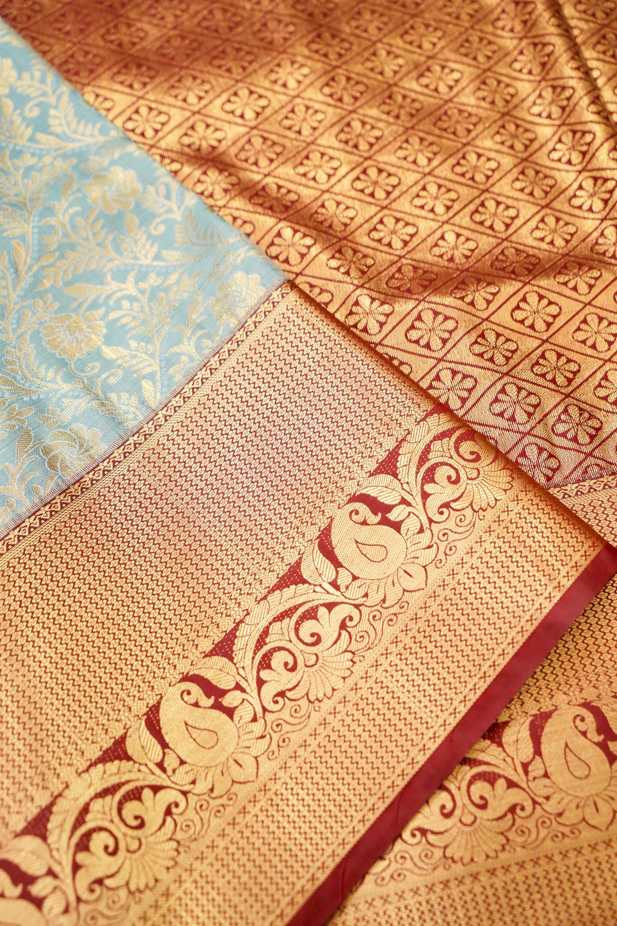 Devyani - Powder Blue Kanchi Pattu Silk Saree with Deep Maroon Korvai Border