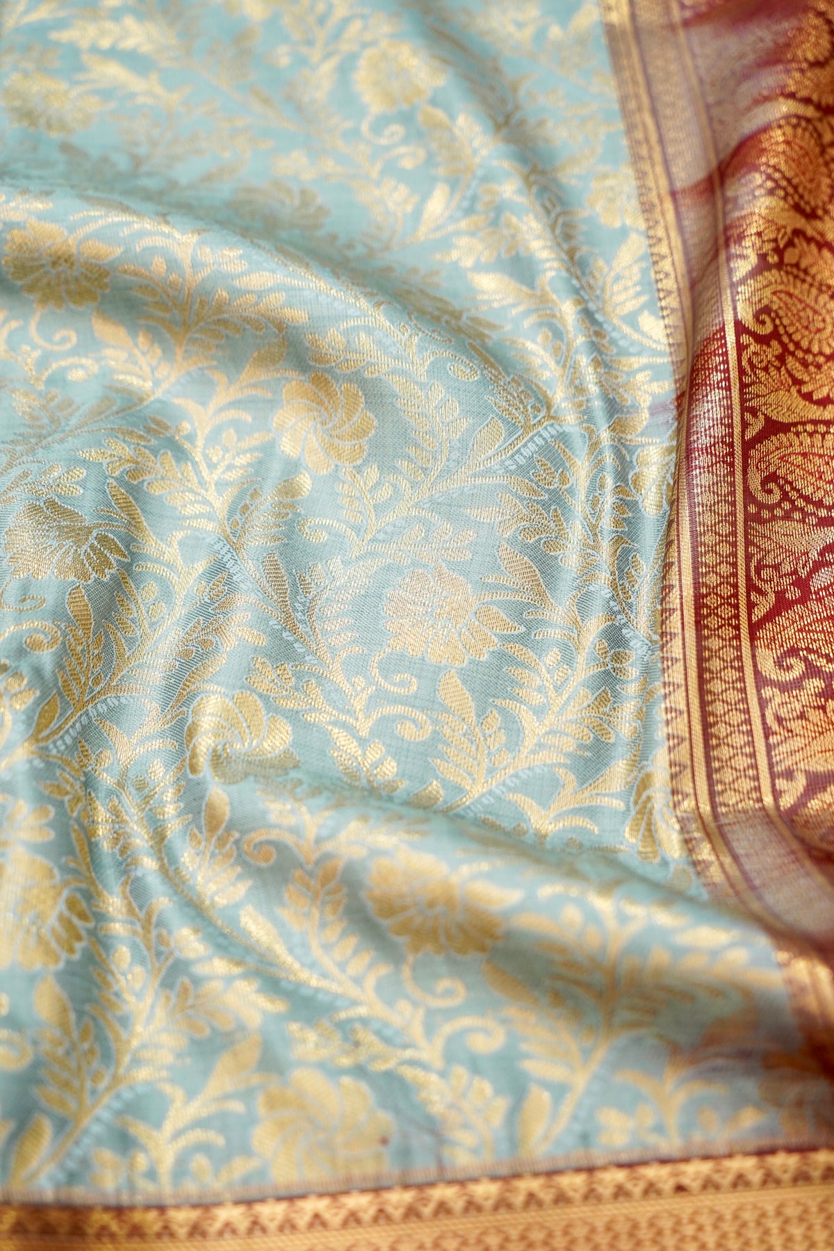 Devyani - Powder Blue Kanchi Pattu Silk Saree with Deep Maroon Korvai Border