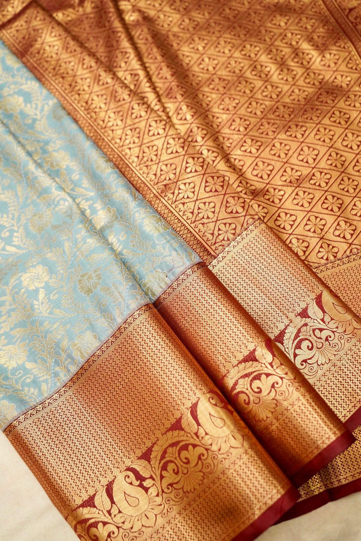 Devyani - Powder Blue Kanchi Pattu Silk Saree with Deep Maroon Korvai Border