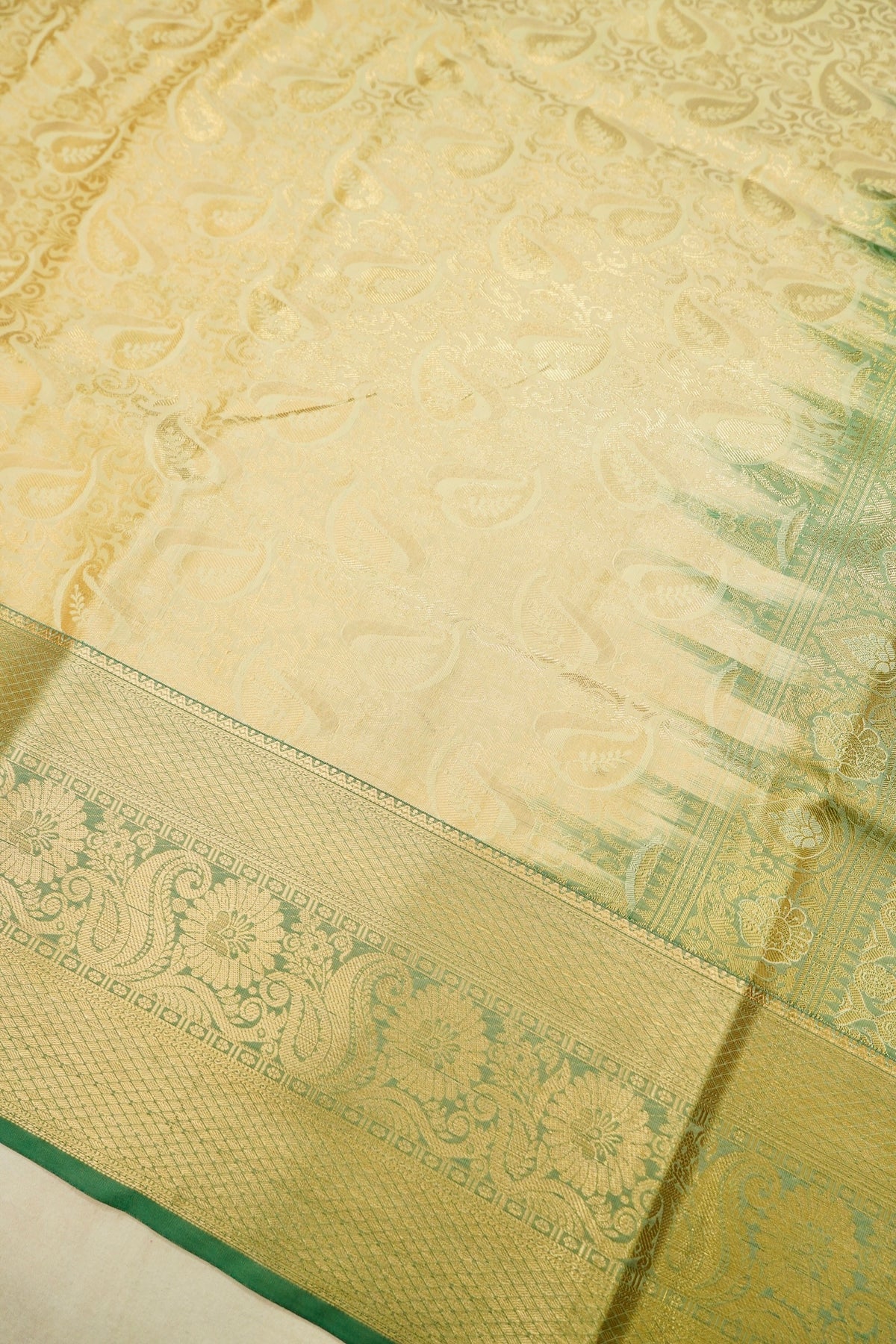 Devyani - Pastel Yellow Kanchi Pattu Silk Saree with Green Border