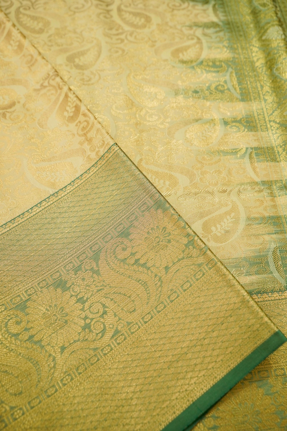 Devyani - Pastel Yellow Kanchi Pattu Silk Saree with Green Border