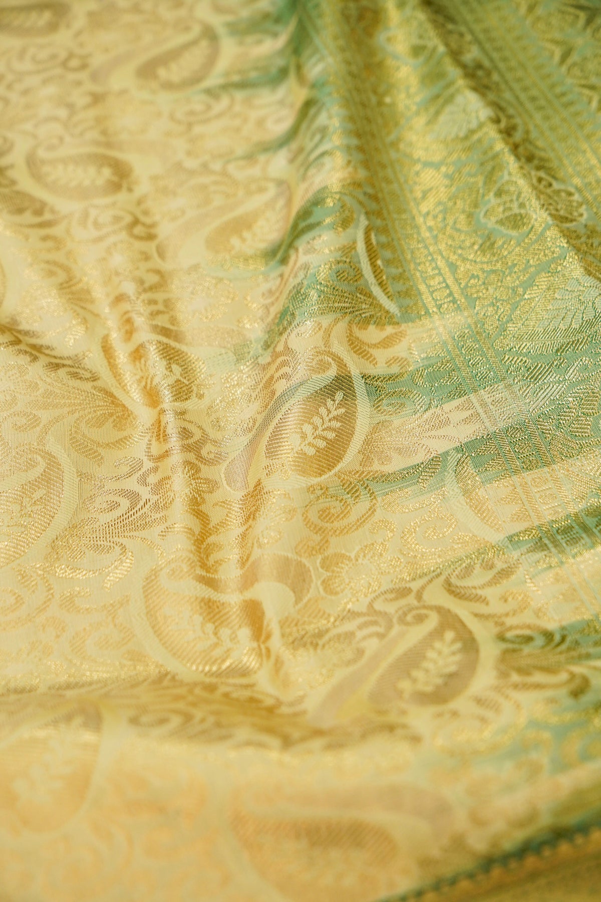 Devyani - Pastel Yellow Kanchi Pattu Silk Saree with Green Border