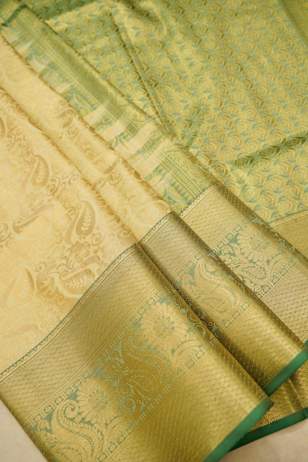 Devyani - Pastel Yellow Kanchi Pattu Silk Saree with Green Border