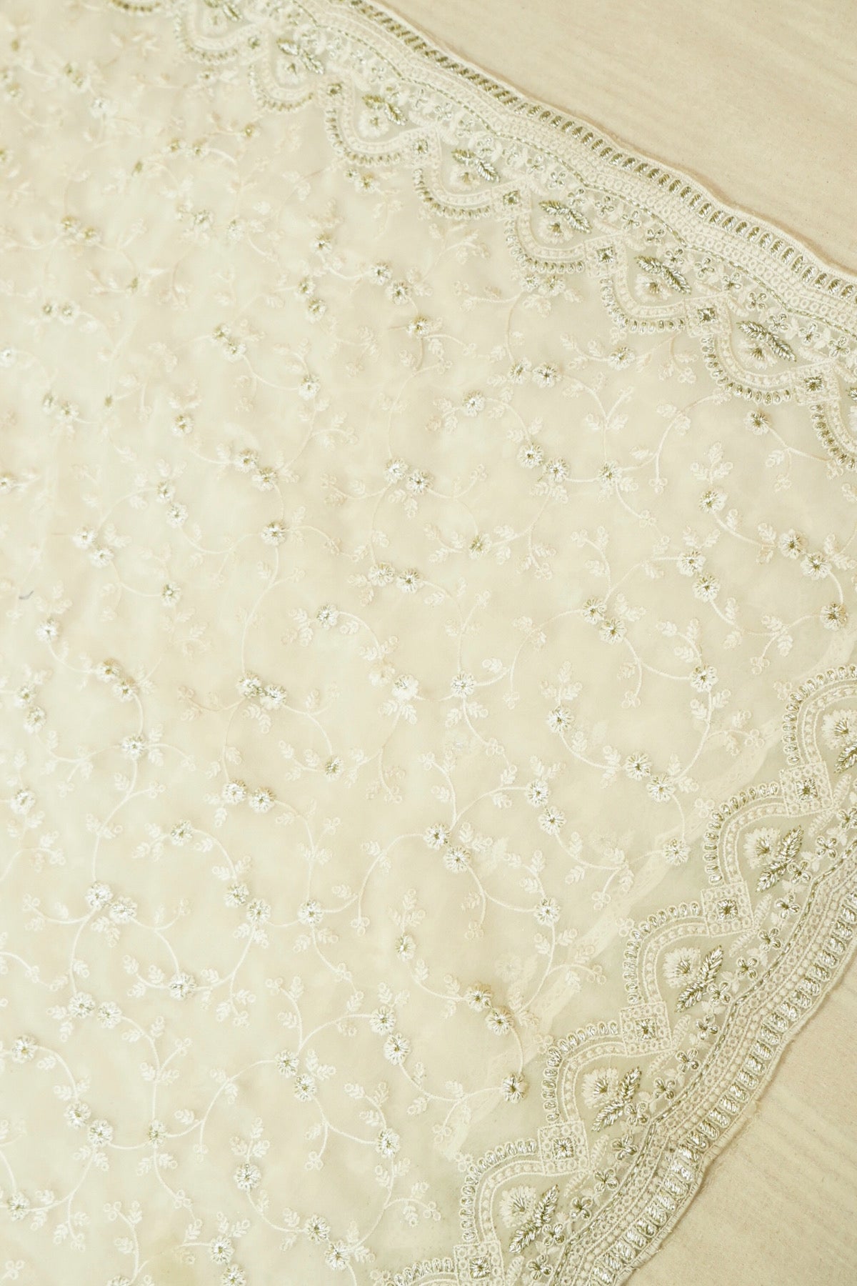 Ivory Floral Embroidered Designer Net Saree with Intricate Border
