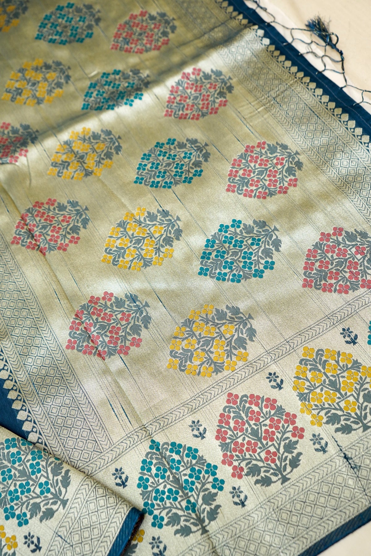 Teal Blue Raw Silk Saree with Multicolor Tree Weave Border
