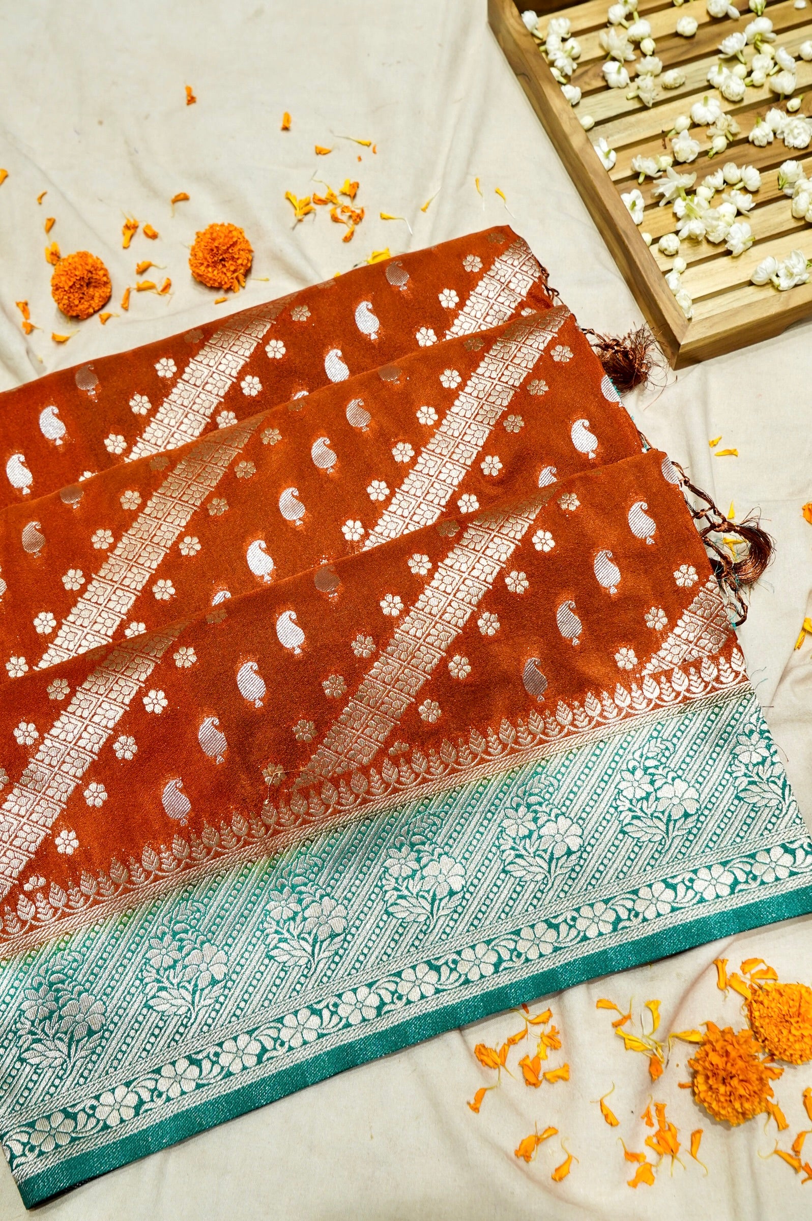 Rust Orange Paisley Crepe Georgette Silk Saree with Aqua Green Border