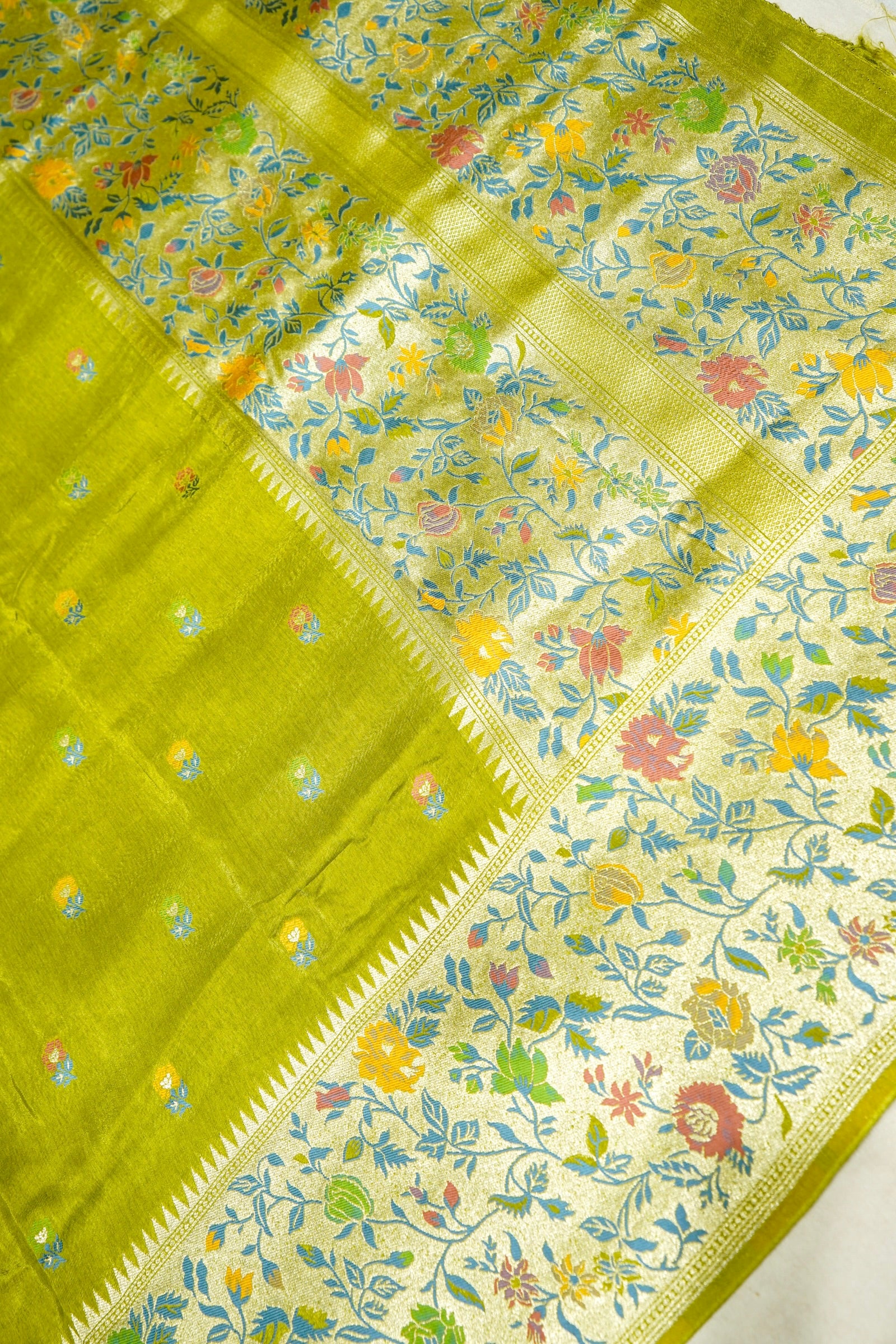 Soft Parrot Green Raw Silk Saree with Pastel Floral Weaving and Ivory Border