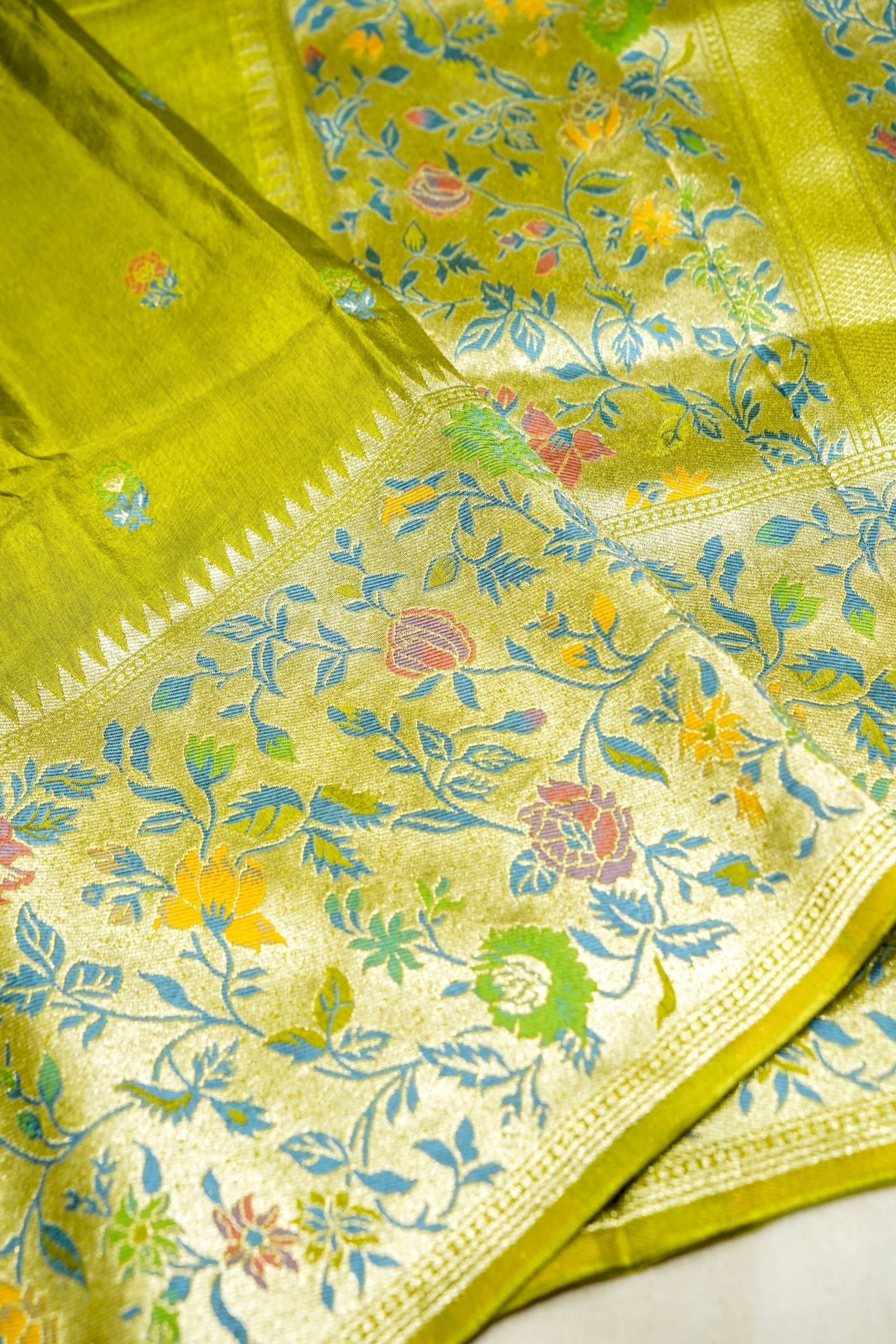 Soft Parrot Green Raw Silk Saree with Pastel Floral Weaving and Ivory Border