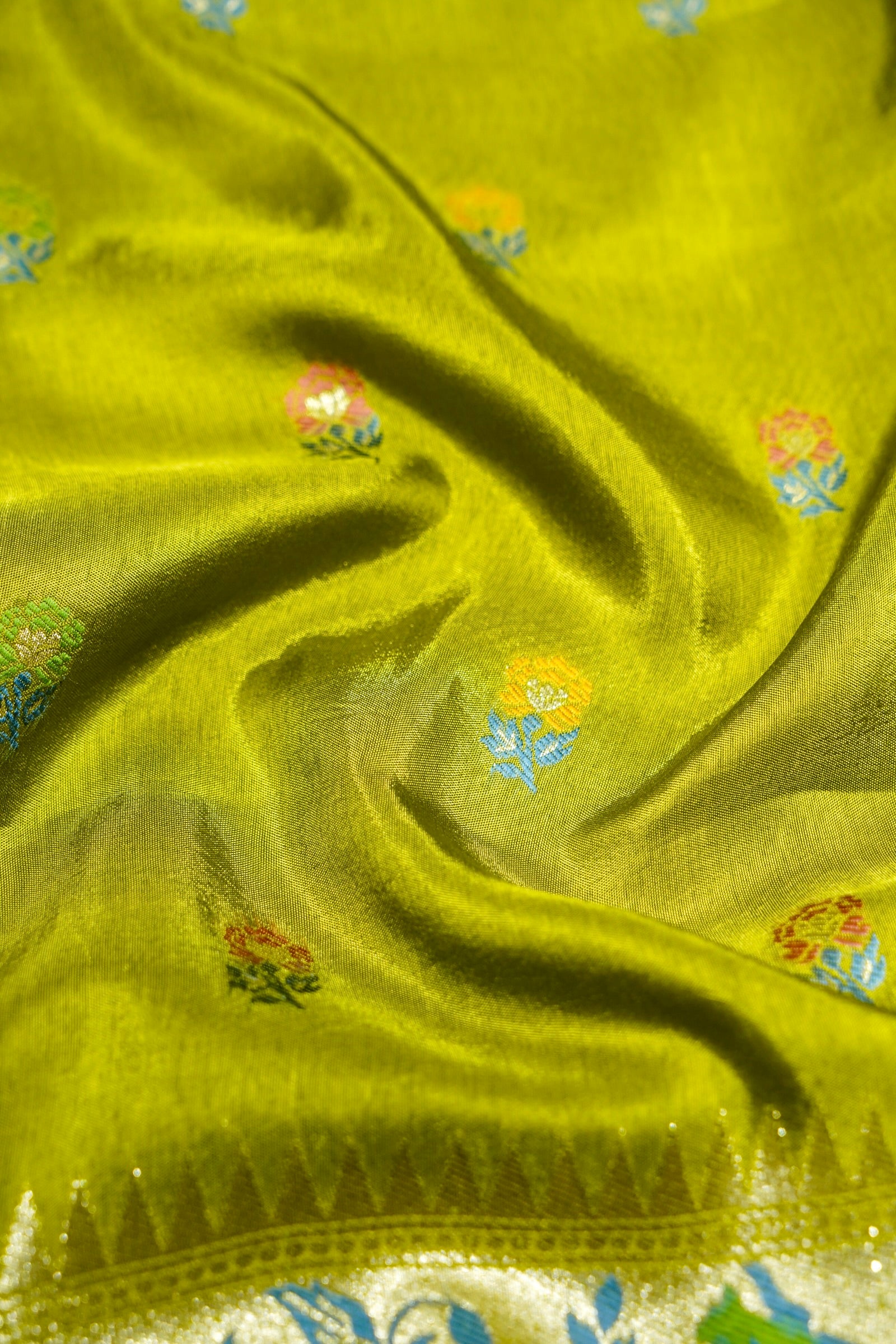 Soft Parrot Green Raw Silk Saree with Pastel Floral Weaving and Ivory Border