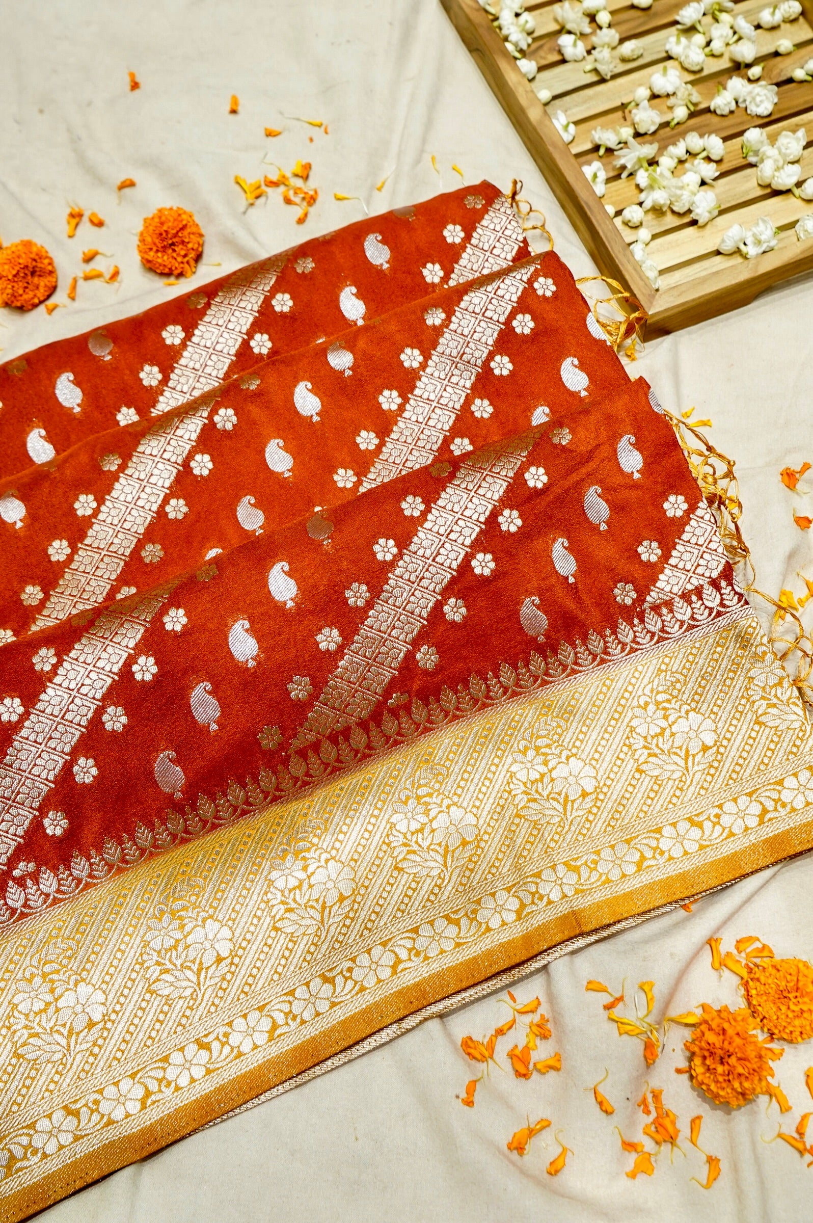Rust Orange Paisley Crepe Georgette Silk Saree with Golden Yellow Border