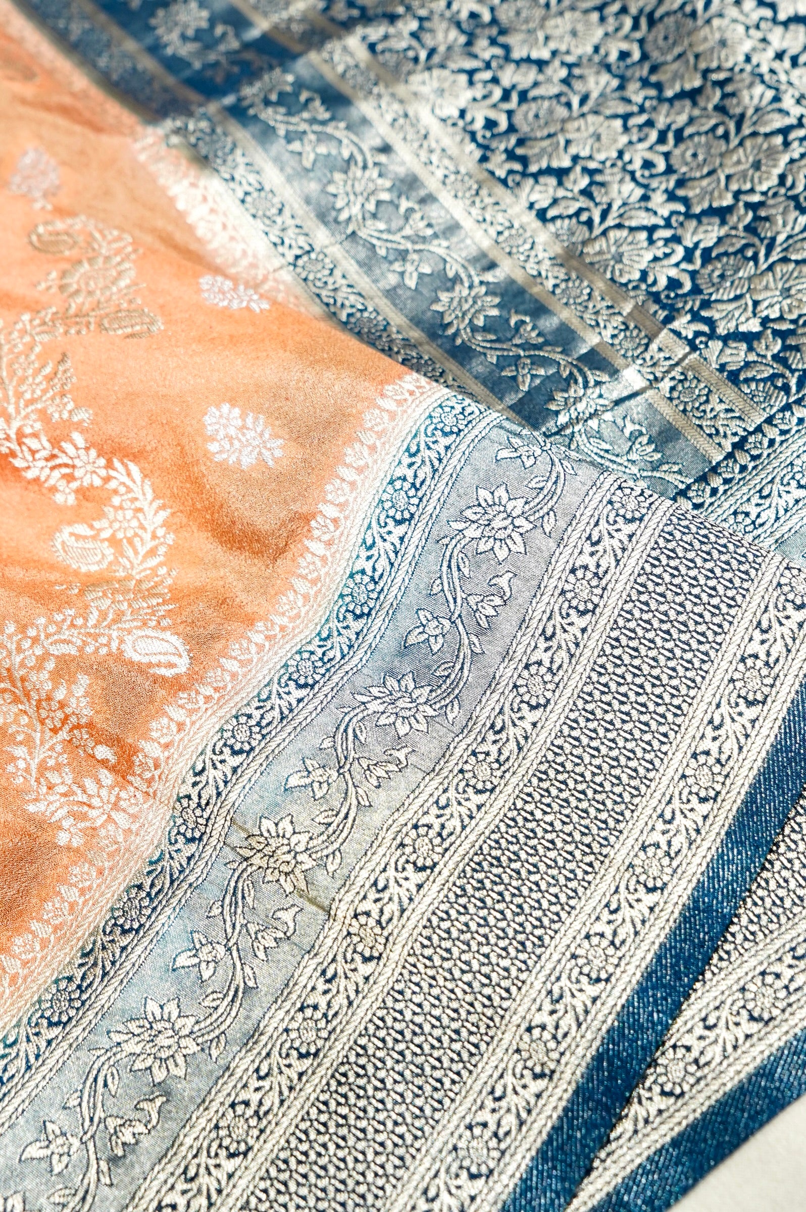 Peach Crepe Georgette Silk Saree with Floral Navy Blue Border
