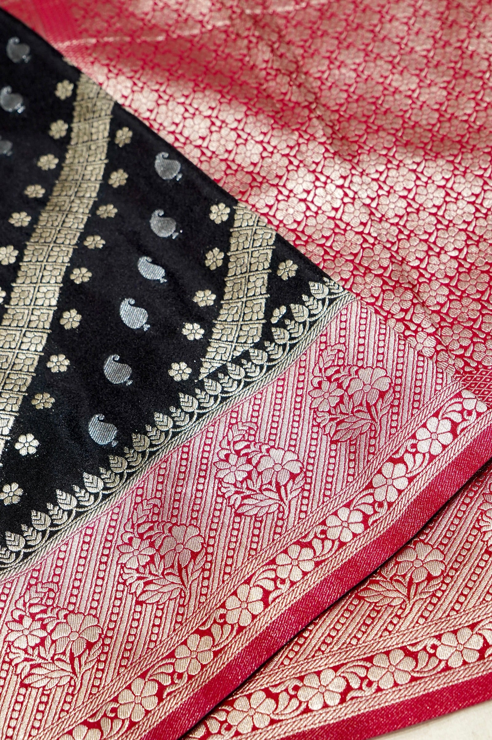 Jet Black Paisley Crepe Georgette Silk Saree with Rani Pink Border