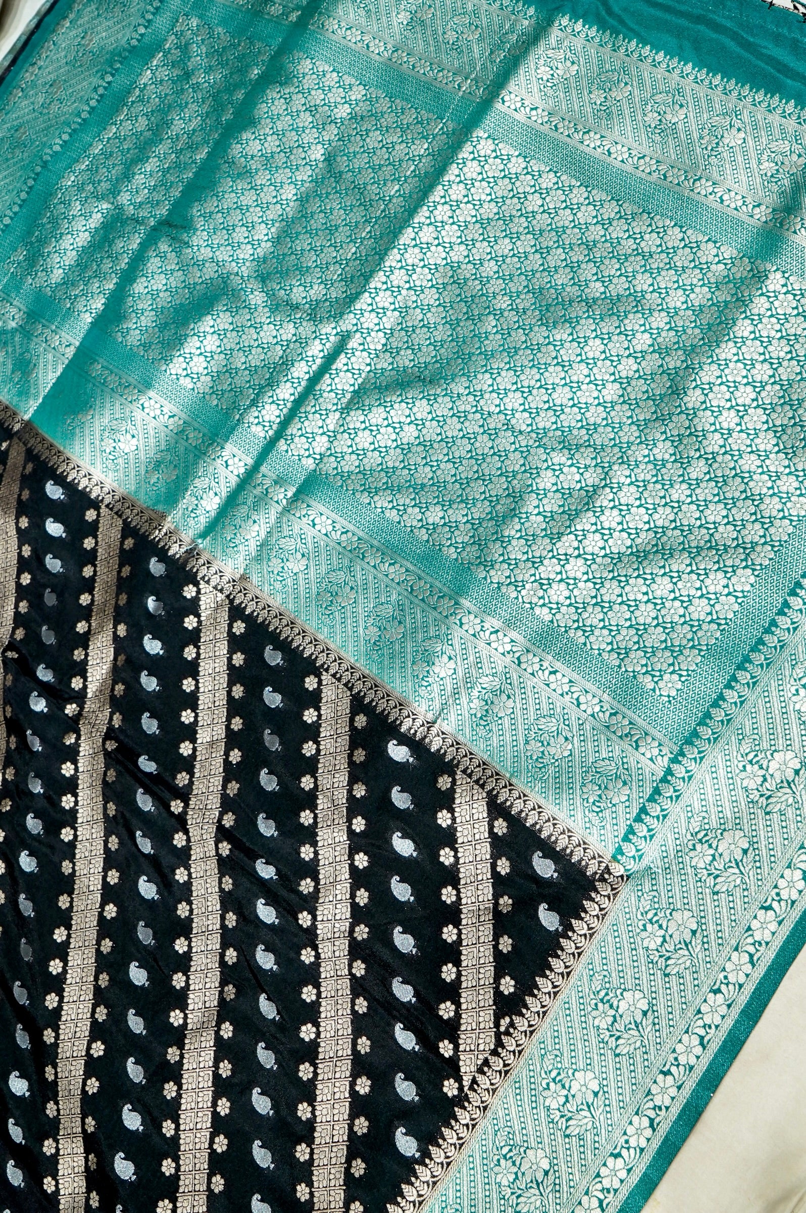 Jet Black Paisley Crepe Georgette Silk Saree with Sea Green Border
