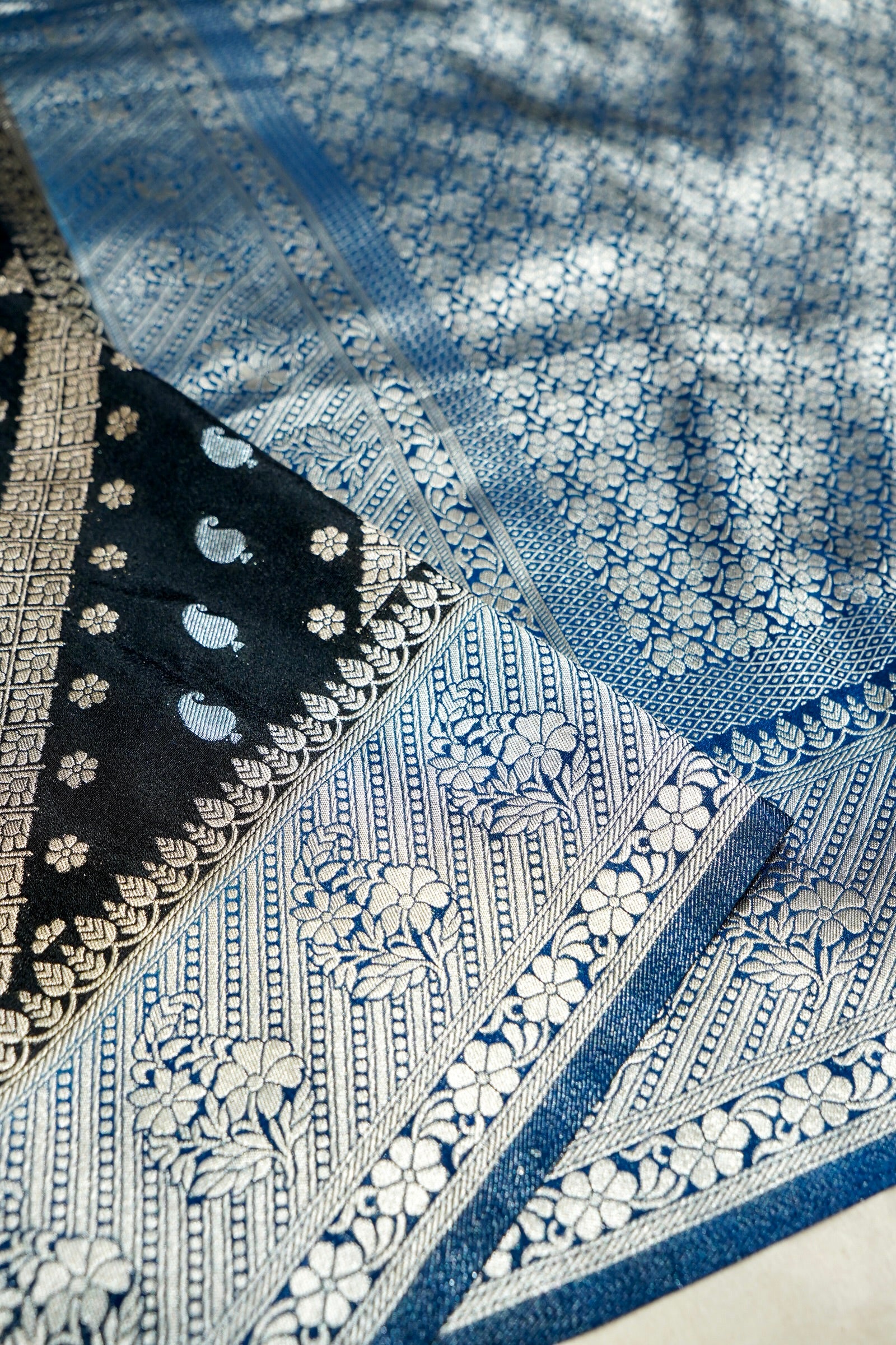Jet Black Paisley Crepe Georgette Silk Saree with Royal Blue Border