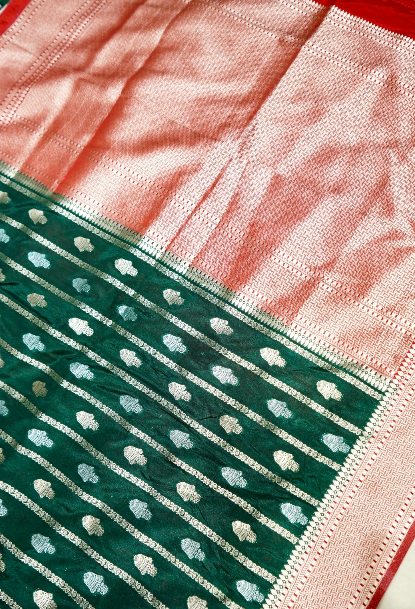 Bottle Green Bell Motifs Crepe Georgette Silk Saree with Red Border