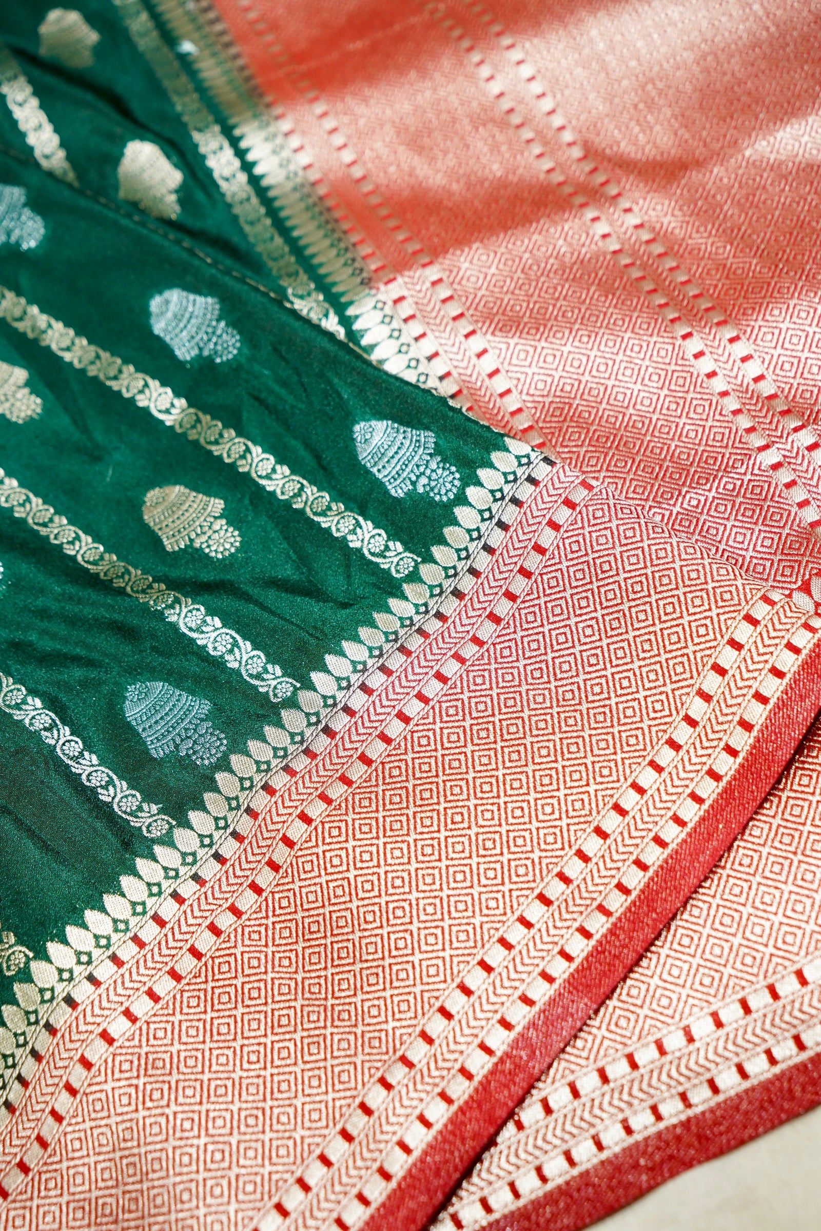 Bottle Green Bell Motifs Crepe Georgette Silk Saree with Red Border