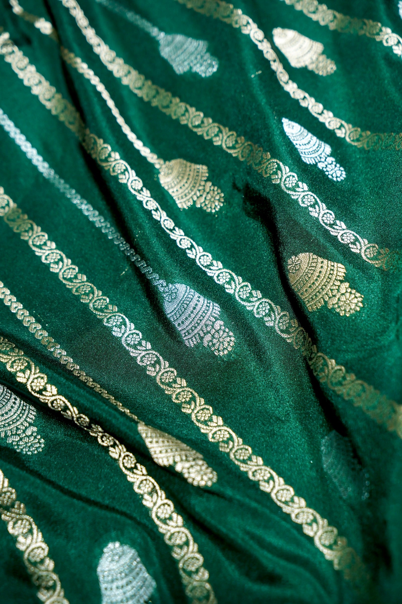 Bottle Green Bell Motifs Crepe Georgette Silk Saree with Red Border