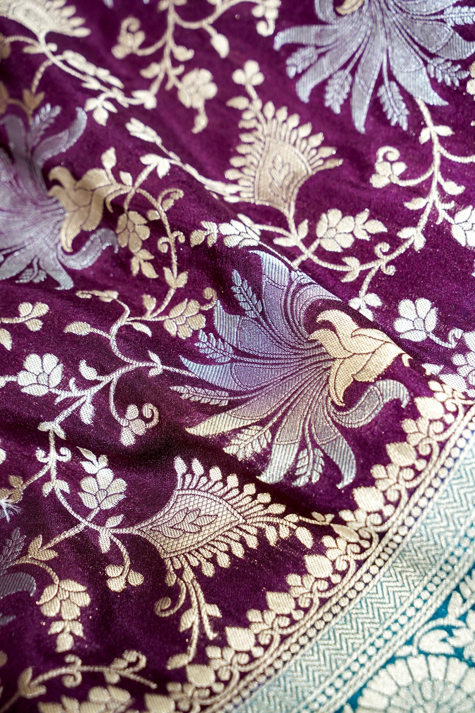 Wine Purple Crepe Georgette Silk Saree with Sea Green Border and Gold - Silver Weave