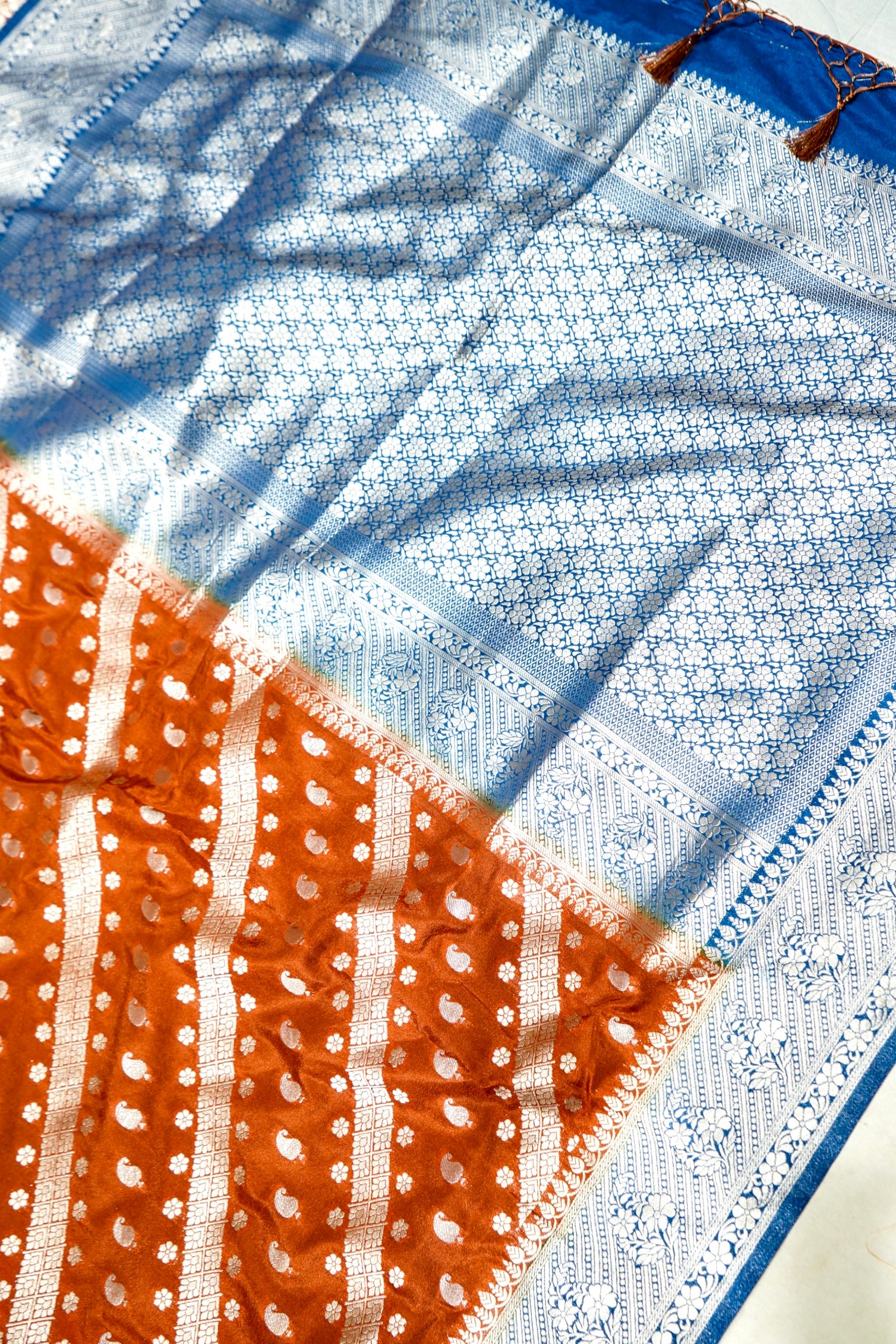 Rust Orange Paisley Crepe Georgette Silk Saree with Cobalt Blue Border