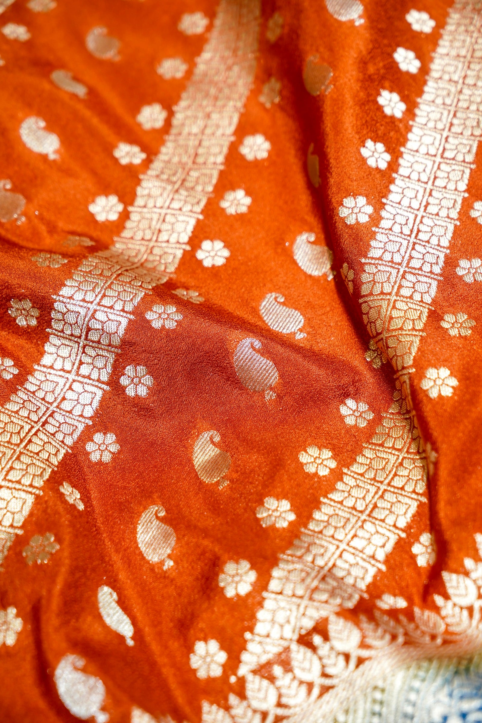 Rust Orange Paisley Crepe Georgette Silk Saree with Cobalt Blue Border
