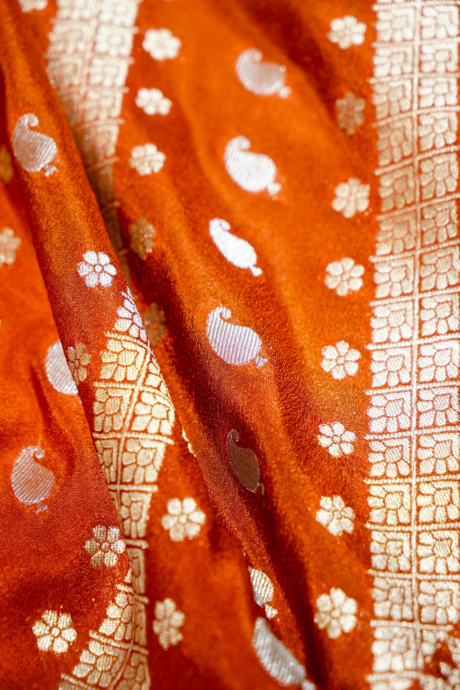 Rust Orange Paisley Crepe Georgette Silk Saree with Aqua Green Border