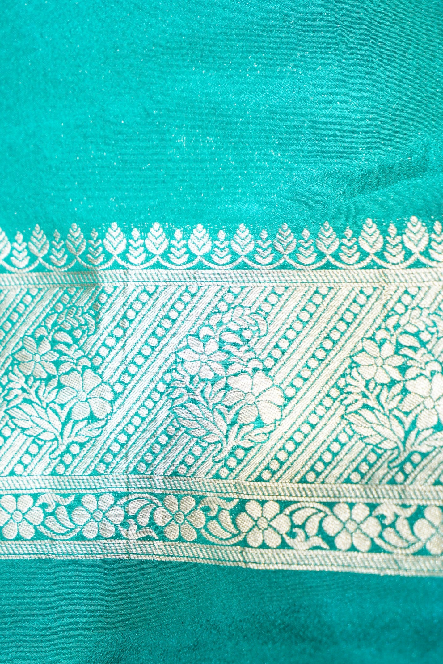 Rust Orange Paisley Crepe Georgette Silk Saree with Aqua Green Border