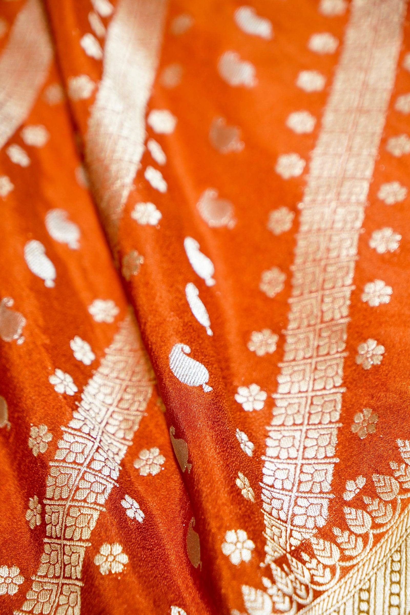 Rust Orange Paisley Crepe Georgette Silk Saree with Mustard Gold Border