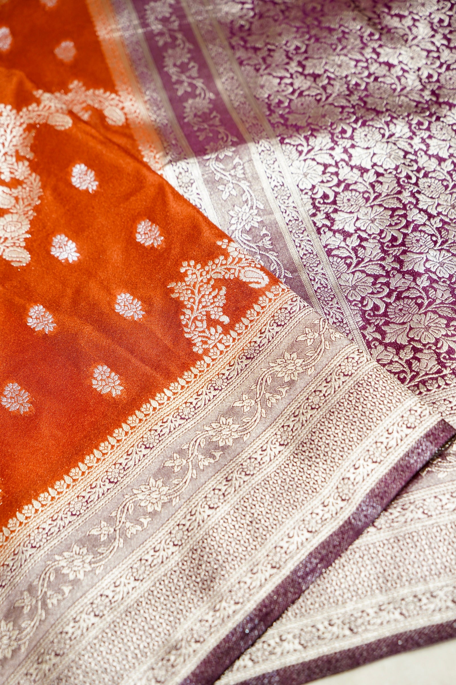 Vibrant Orange Crepe Georgette Silk Saree with Floral Wine Border
