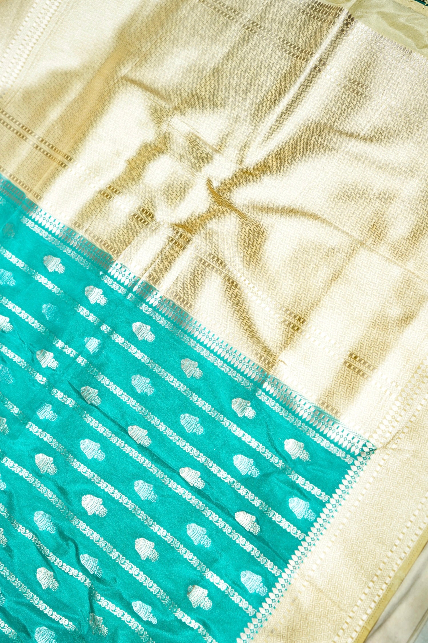 Aqua Green Bell Motifs Crepe Georgette Silk Saree with Champagne Border