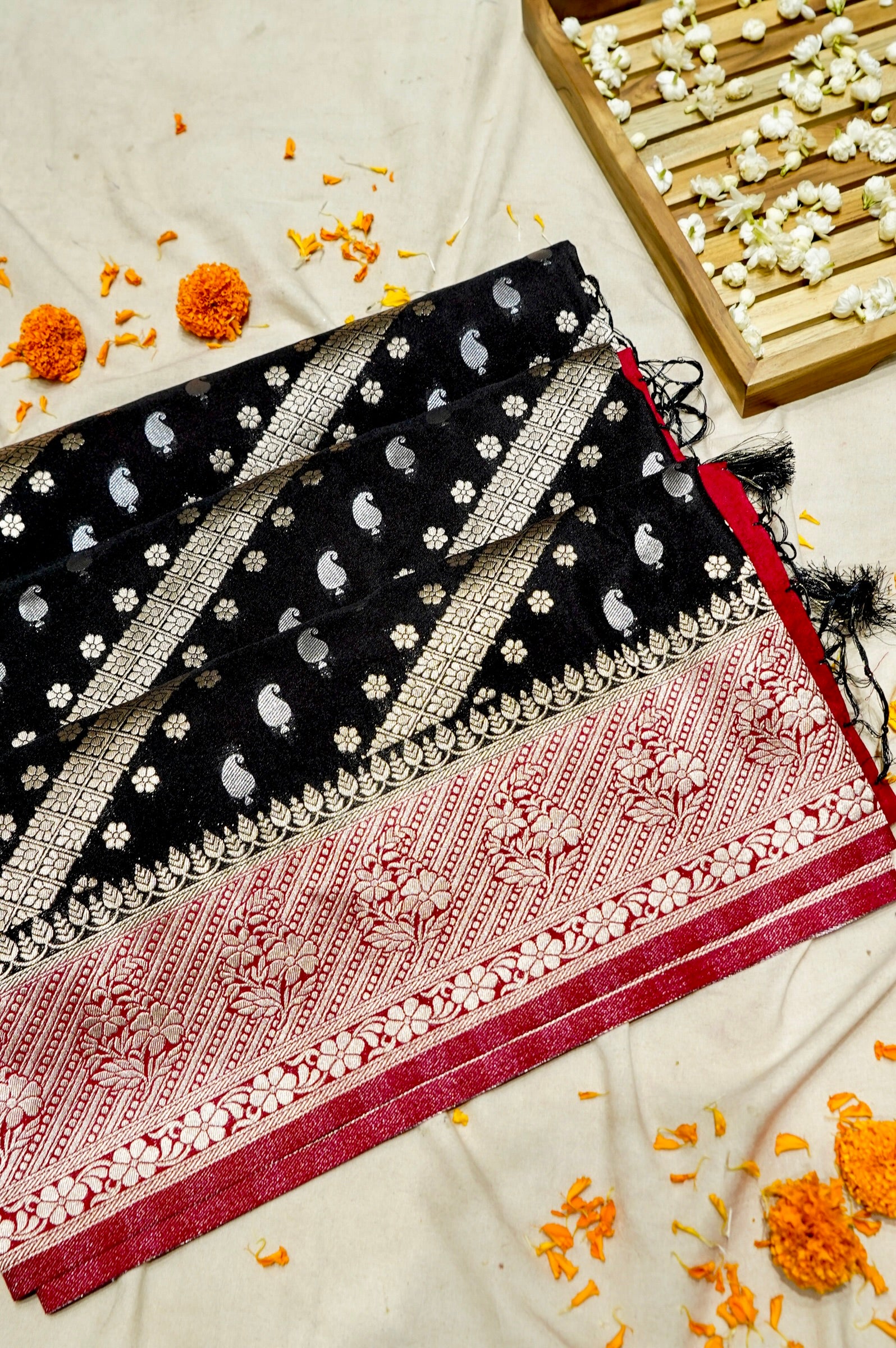Jet Black Paisley Crepe Georgette Silk Saree with Rani Pink Border