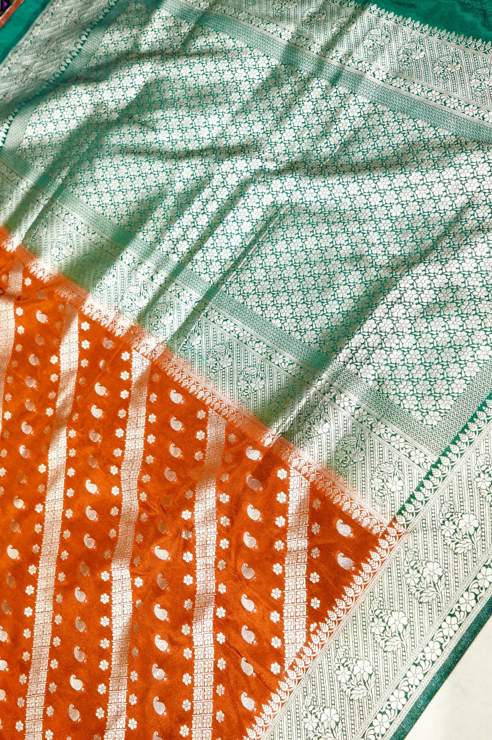 Rust Orange Paisley Crepe Georgette Silk Saree with Jade Green Border