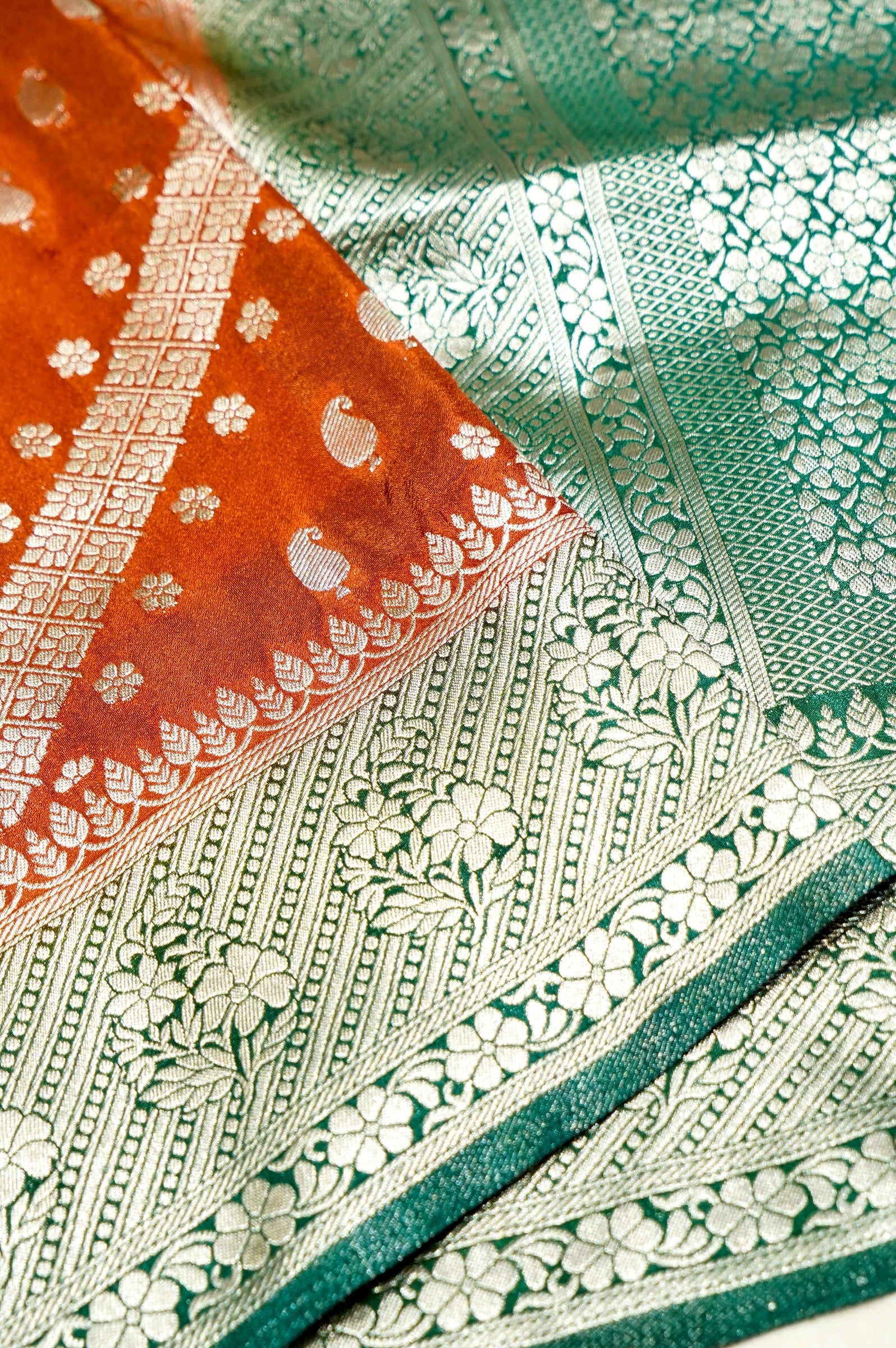 Rust Orange Paisley Crepe Georgette Silk Saree with Jade Green Border