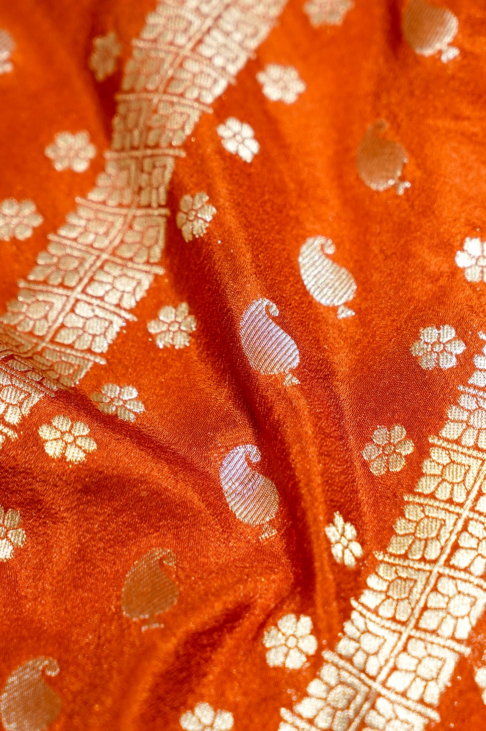 Rust Orange Paisley Crepe Georgette Silk Saree with Jade Green Border