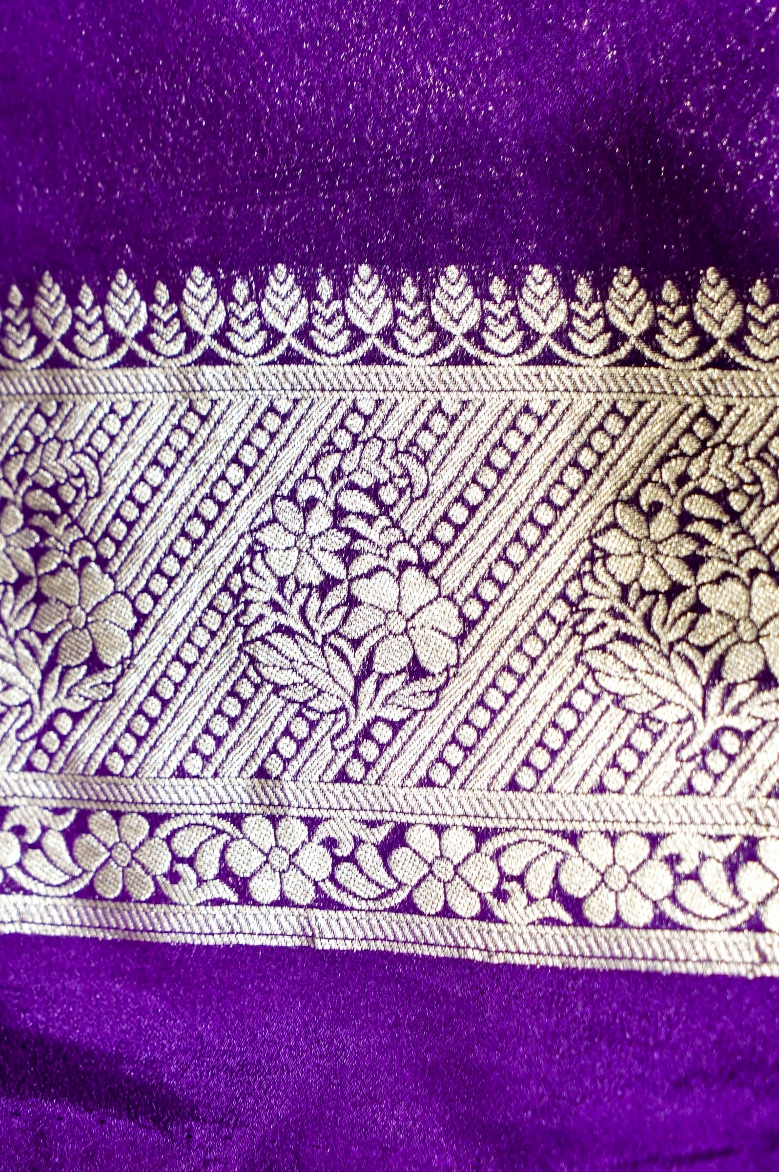 Rust Orange Paisley Crepe Georgette Silk Saree with Royal Purple Border