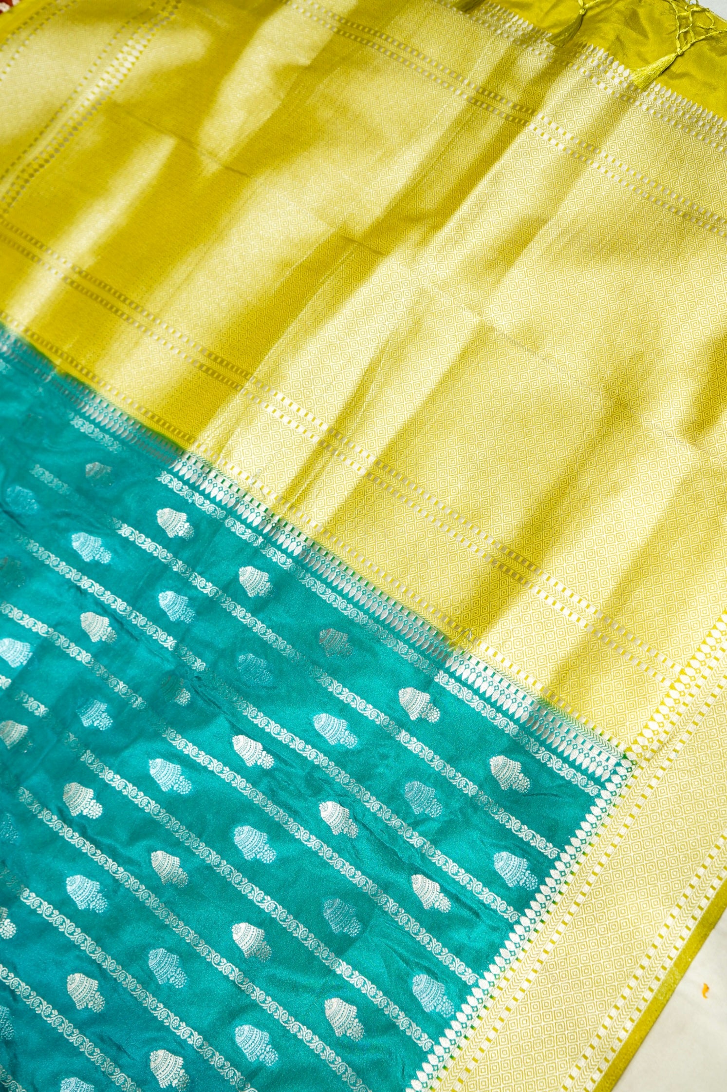 Turquoise Blue Bell Motifs Crepe Georgette Silk Saree with line green Border