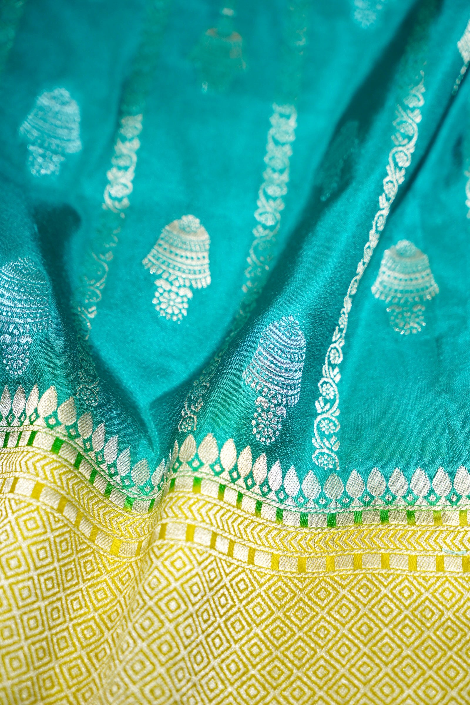 Turquoise Blue Bell Motifs Crepe Georgette Silk Saree with line green Border