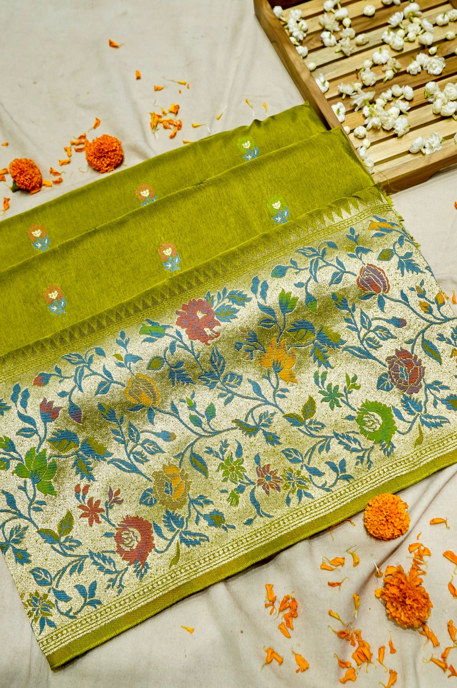 Soft Parrot Green Raw Silk Saree with Pastel Floral Weaving and Ivory Border