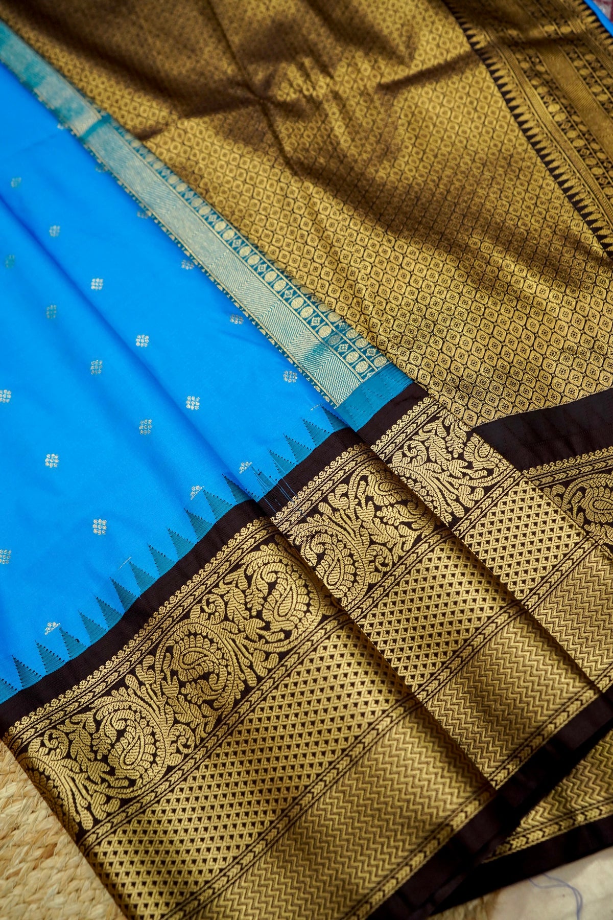 Suvarna - Bright Turquoise Blue Gadwal Silk Saree with Brown Gold Border