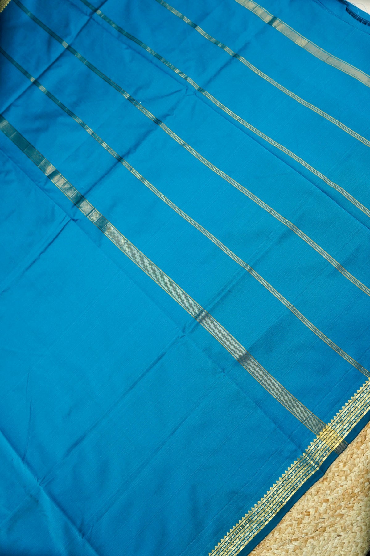 Suvarna - Peacock Blue Mysore Crepe Silk Saree with Gold Kaat Border