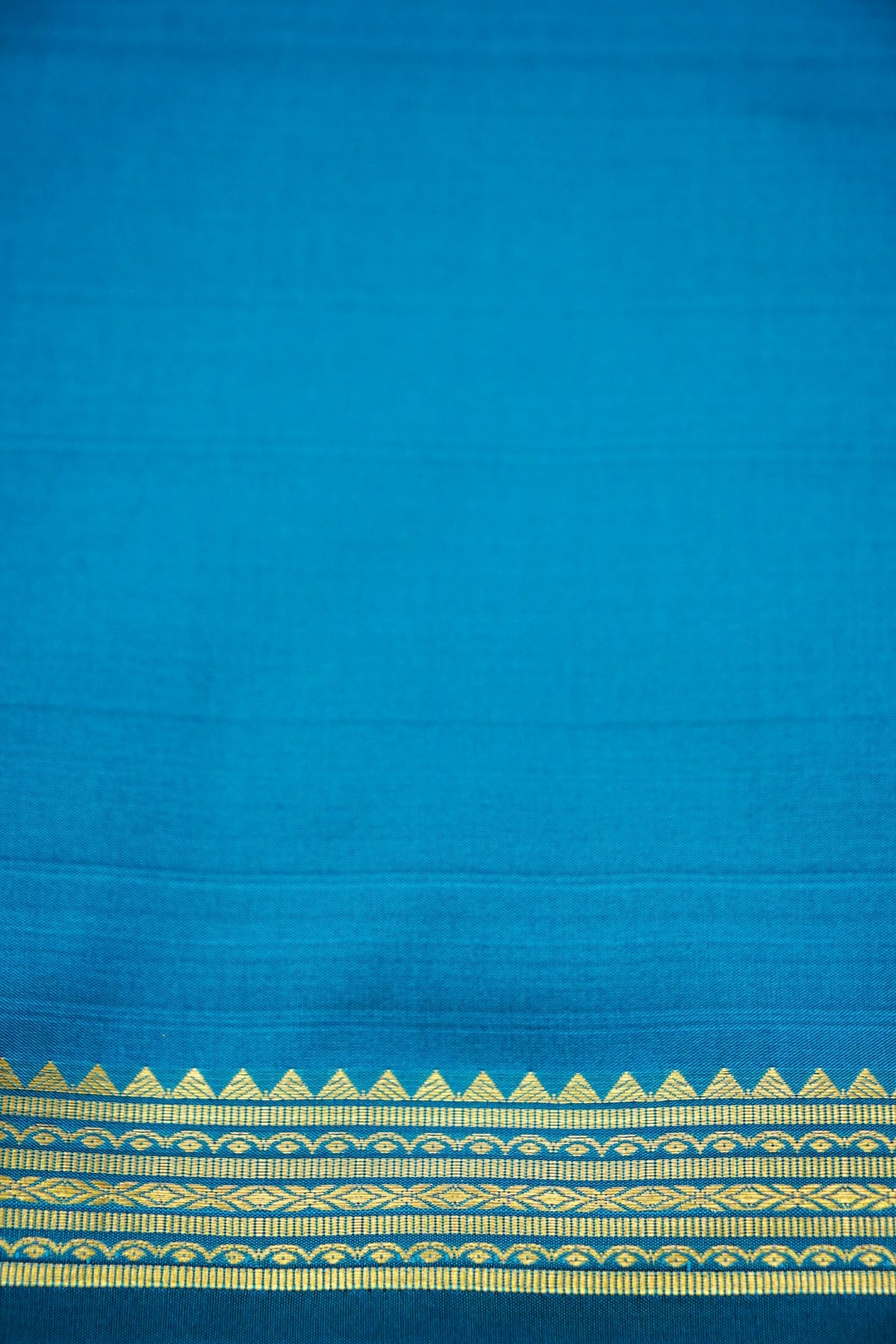 Suvarna - Peacock Blue Mysore Crepe Silk Saree with Gold Kaat Border