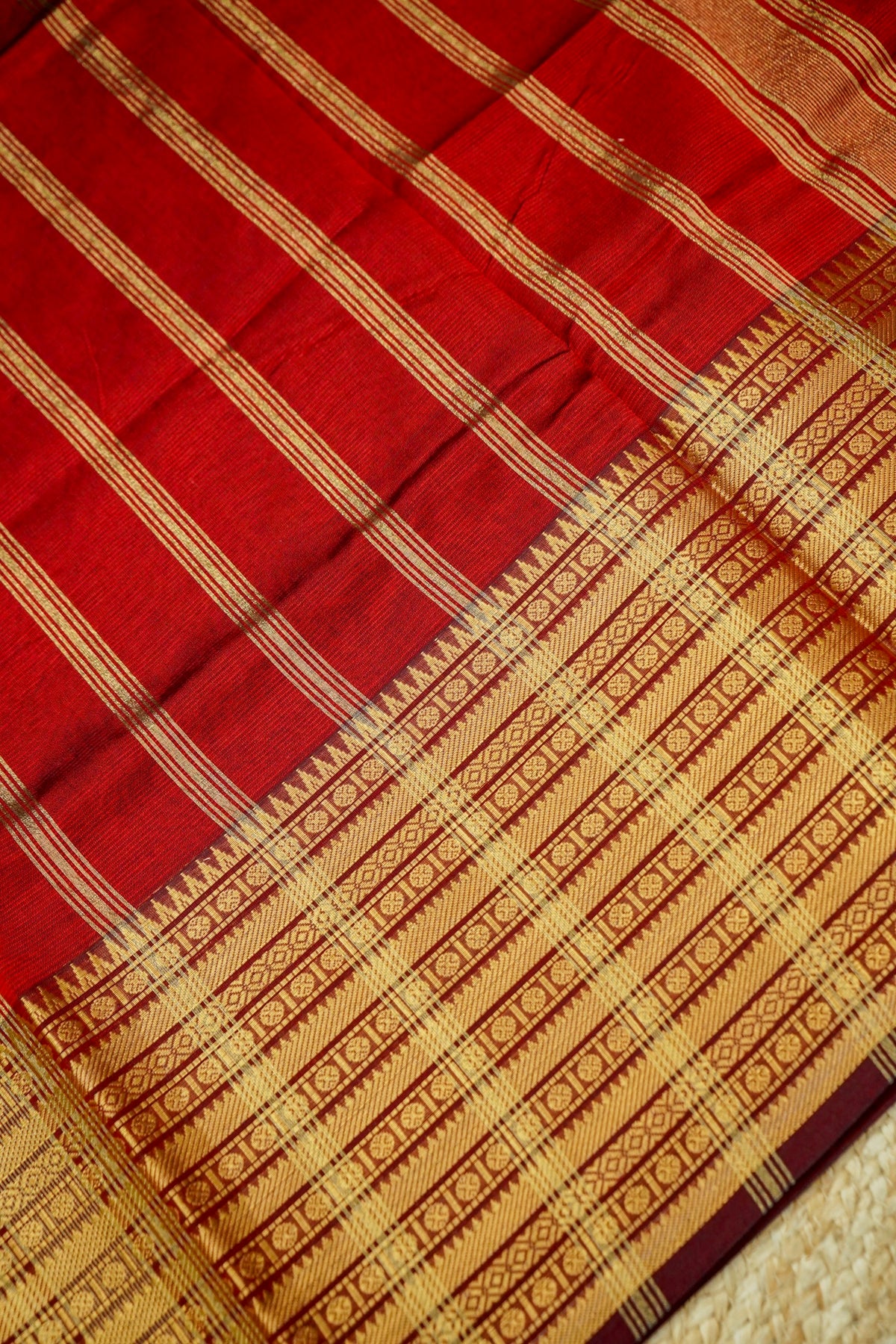 Suvarna - Ruby Red Gadwal Silk Saree with Antique Gold Zari Border