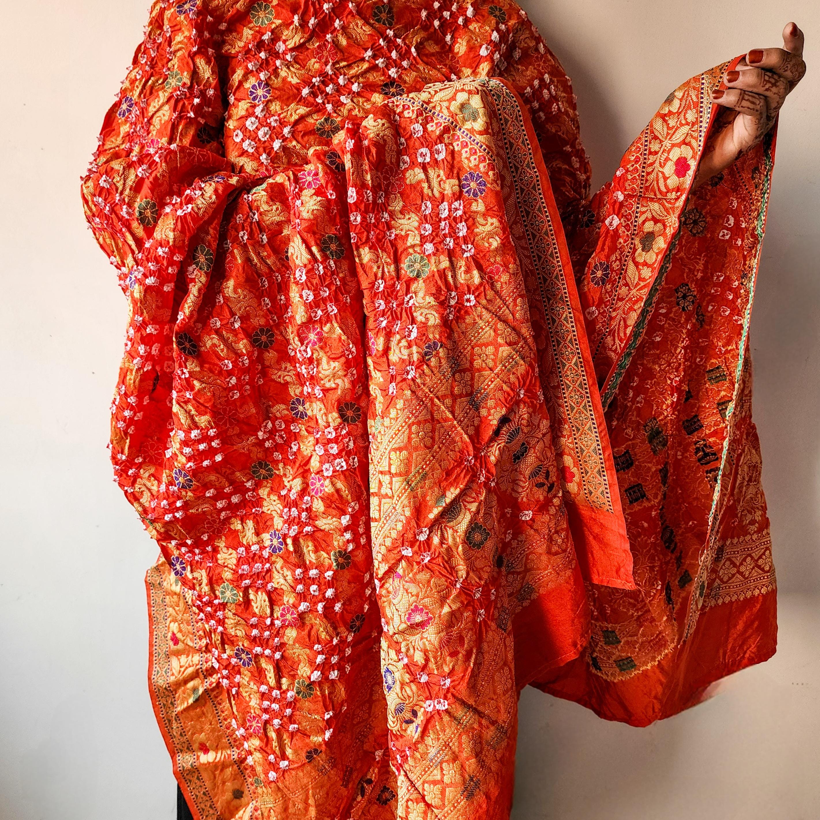 Orange Bandhni dupatta with Banarasi Meenakari work