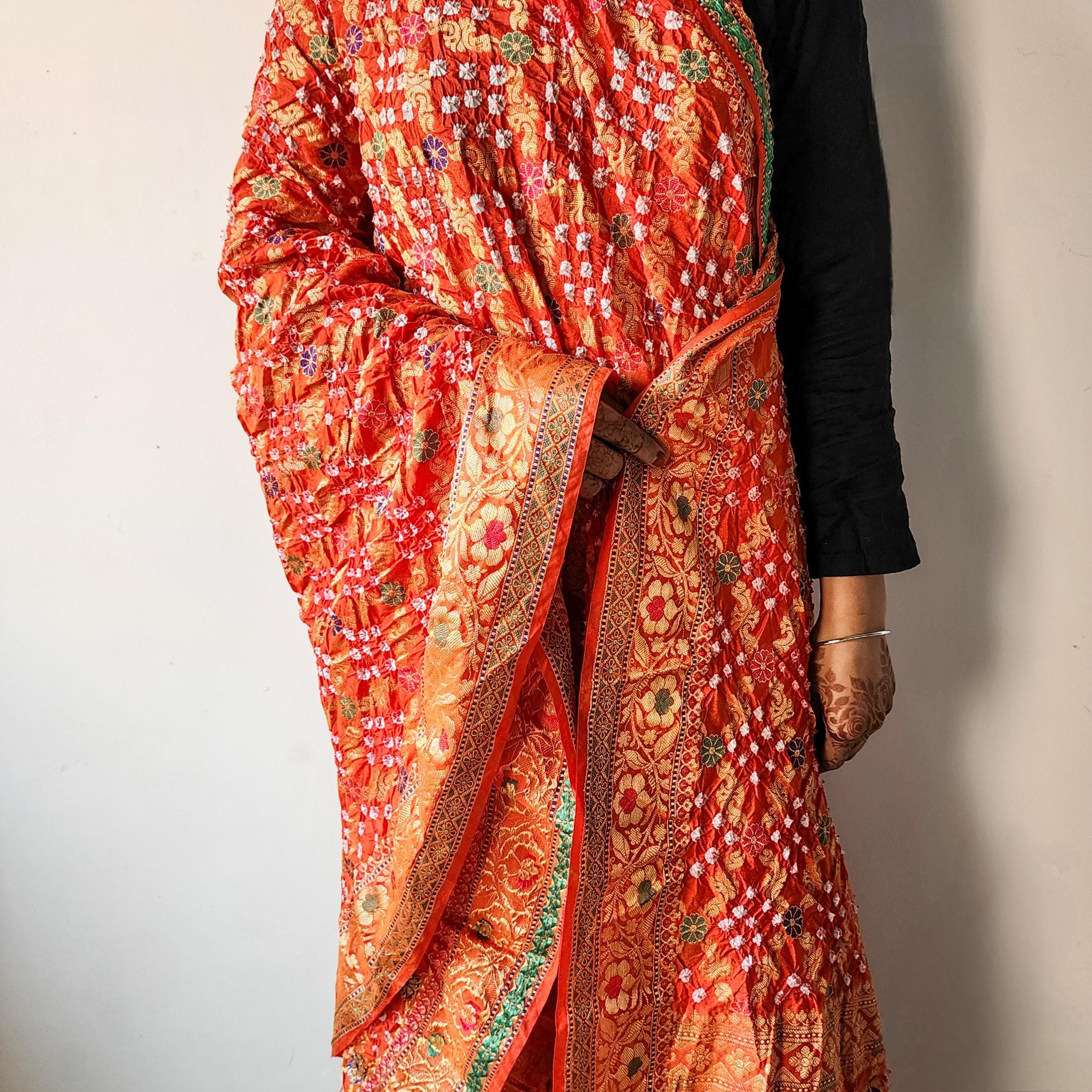 Orange Bandhni dupatta with Banarasi Meenakari work